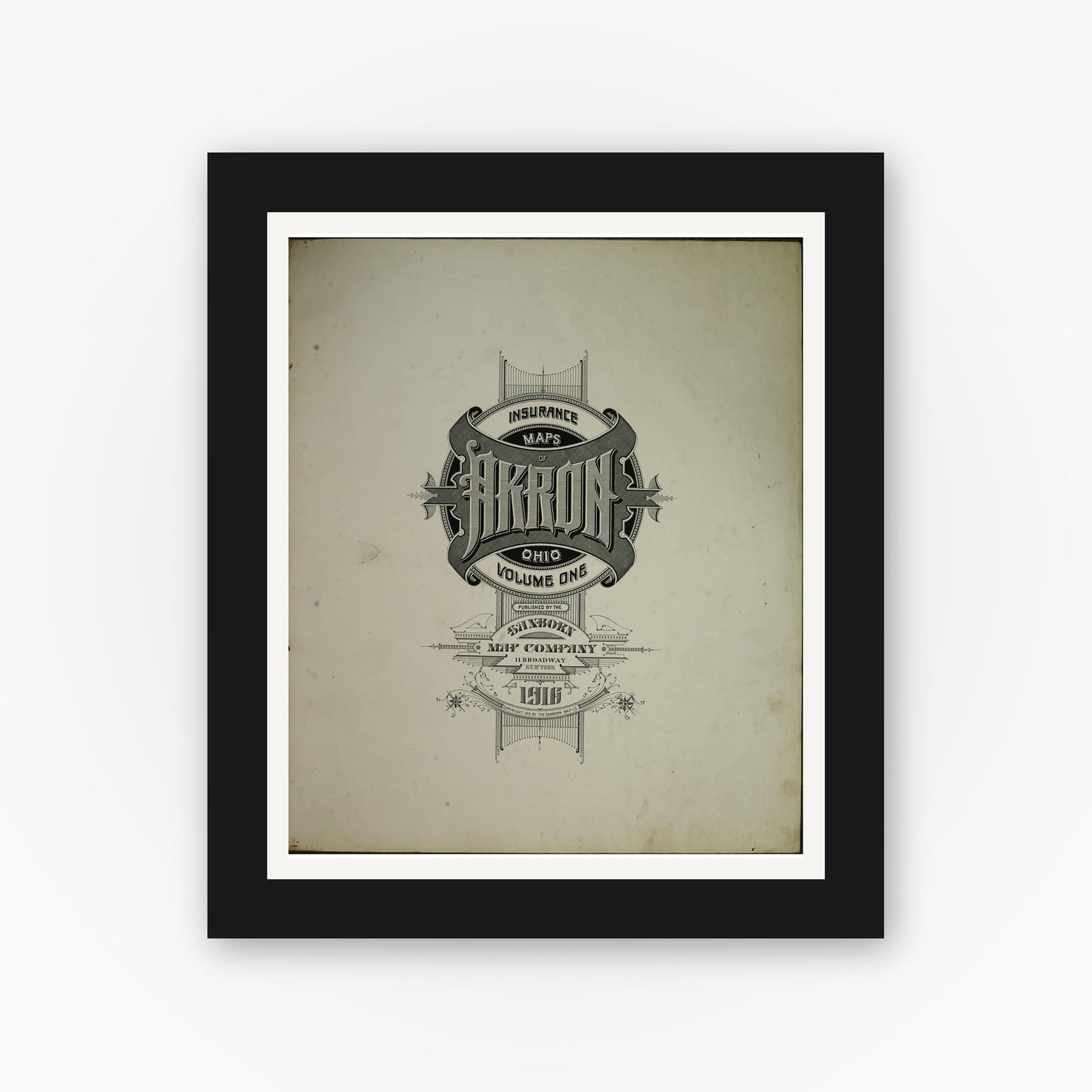 Old map wall art mockup — black gallery frame with white mat — Sanborn Fire Insurance Map from Akron, Summit County, Ohio (1916), Sheet #0001
