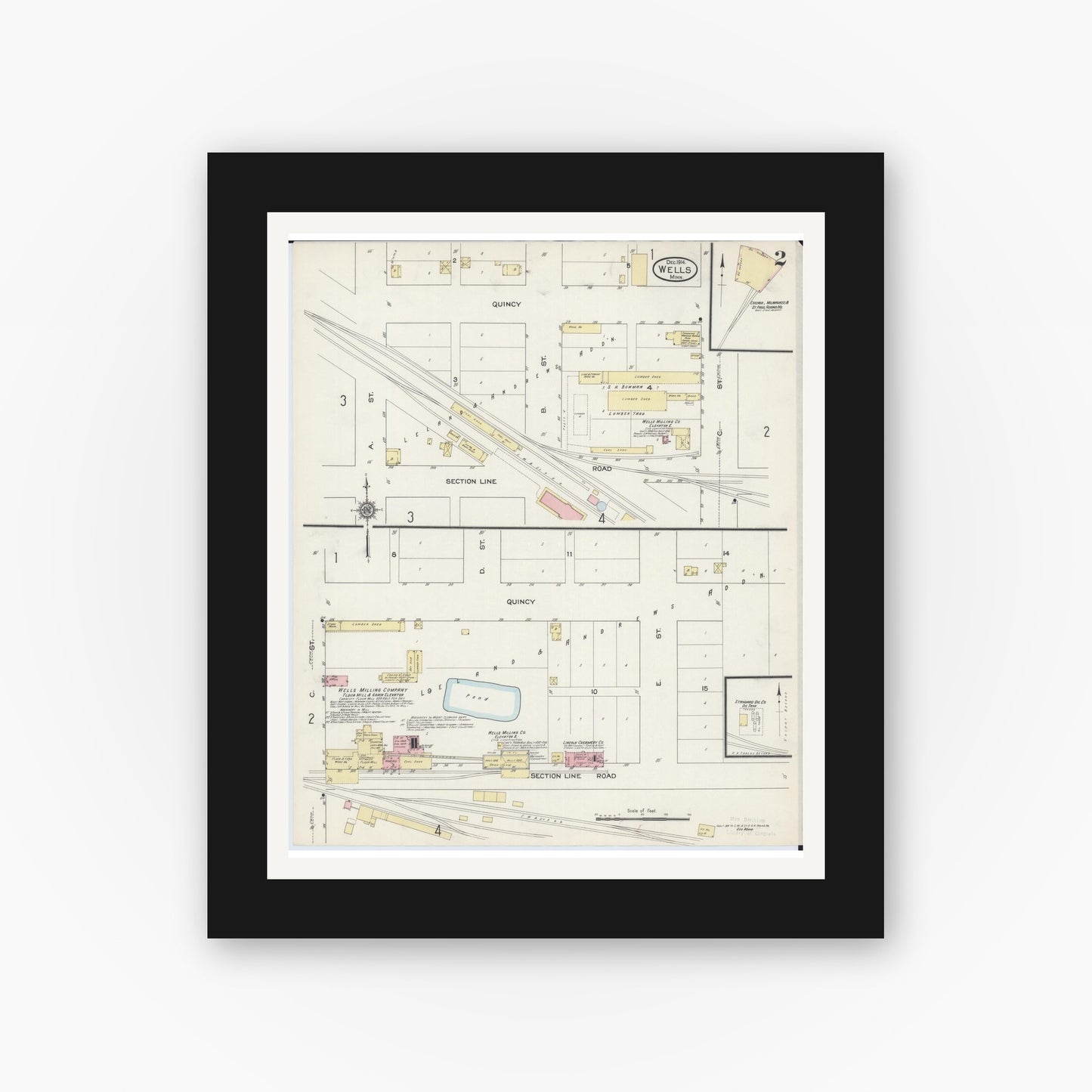 Old map wall art mockup — black gallery frame with white mat — Sanborn Fire Insurance Map from Wells, Faribault County, Minnesota (1914), Sheet #0002