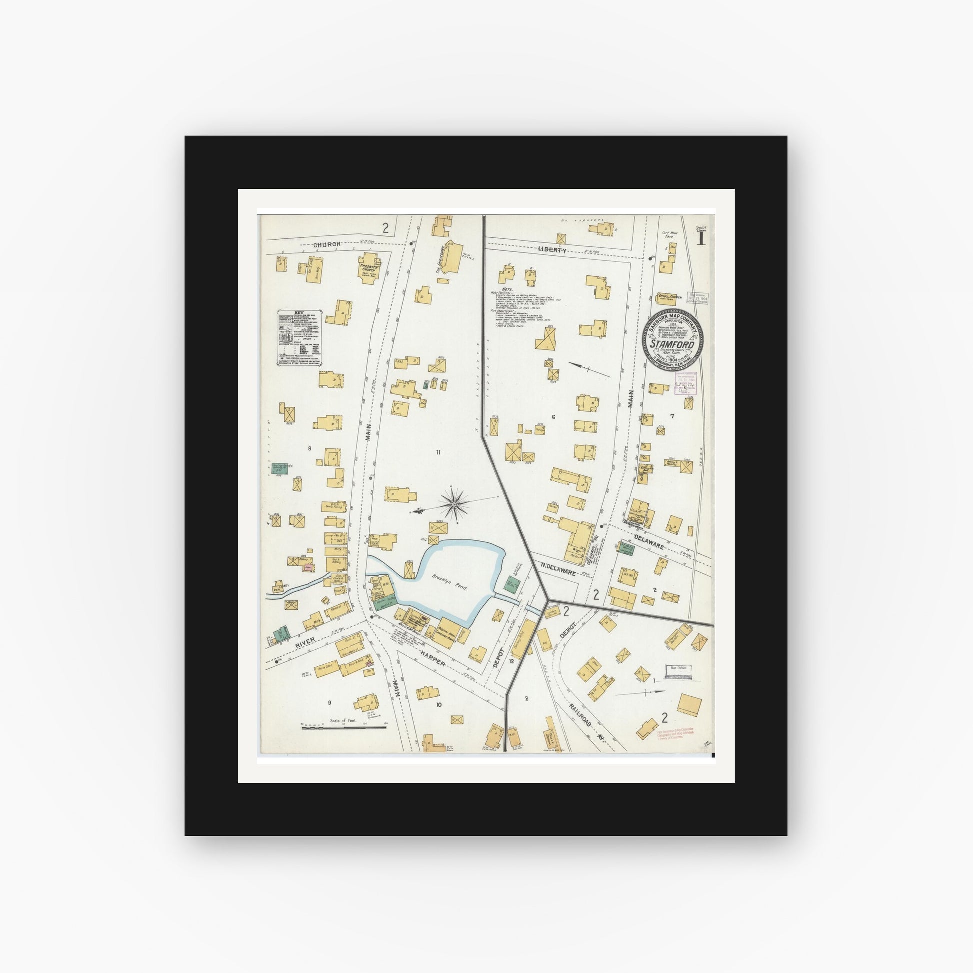 Old map wall art mockup — black gallery frame with white mat — Sanborn Fire Insurance Map from Stamford, Delaware County, New York (1904), Sheet #0001