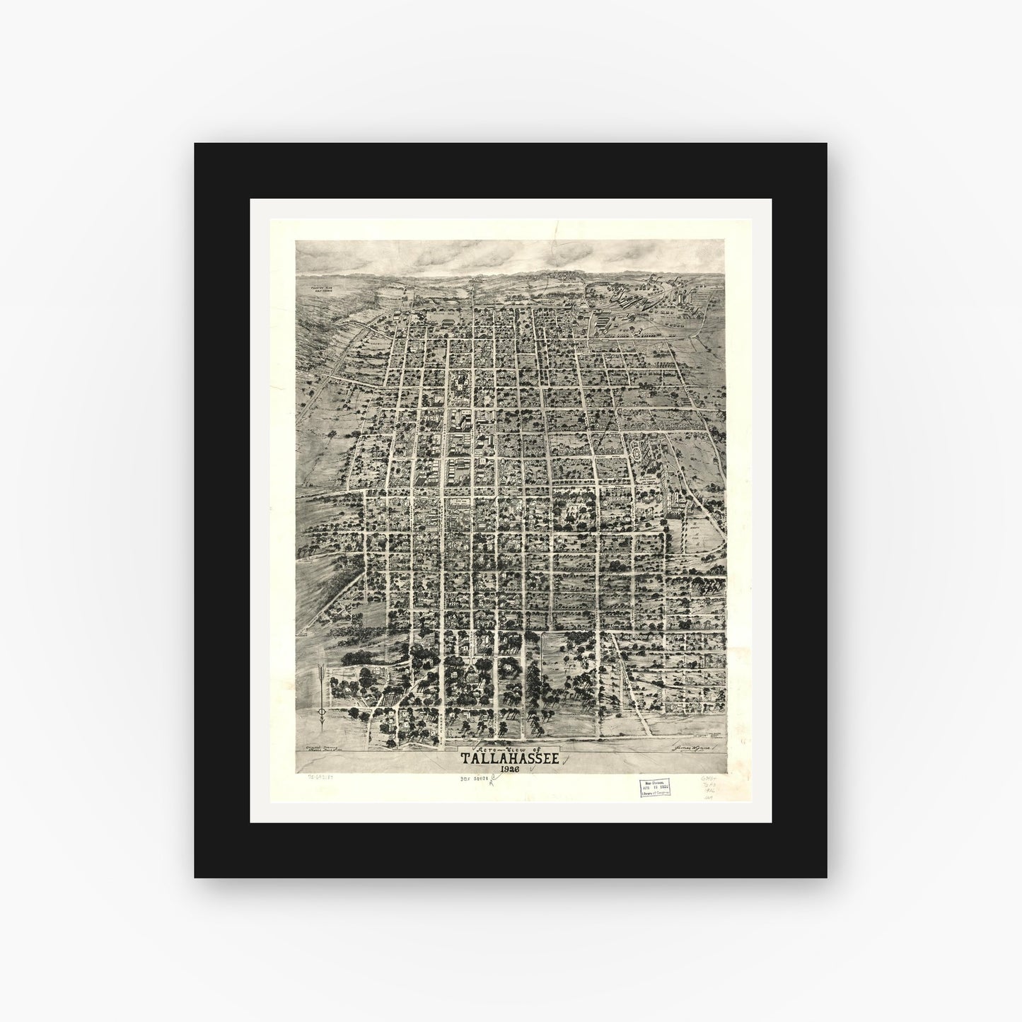 Old map wall art mockup — black gallery frame with white mat — Aero-view of Tallahassee 1926. (1926)