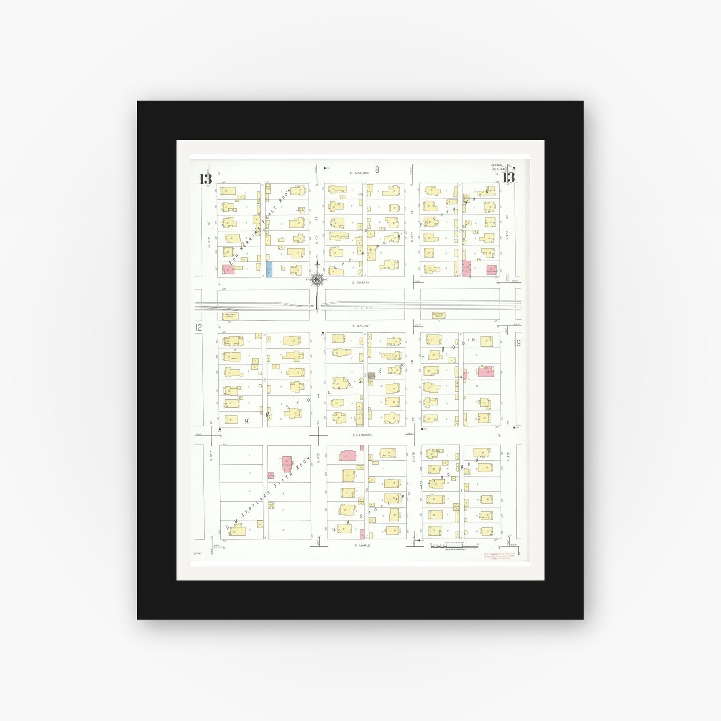 Old map wall art mockup — black gallery frame with white mat — Sanborn Fire Insurance Map from Herrin, Williamson County, Illinois (1941), Sheet #0013