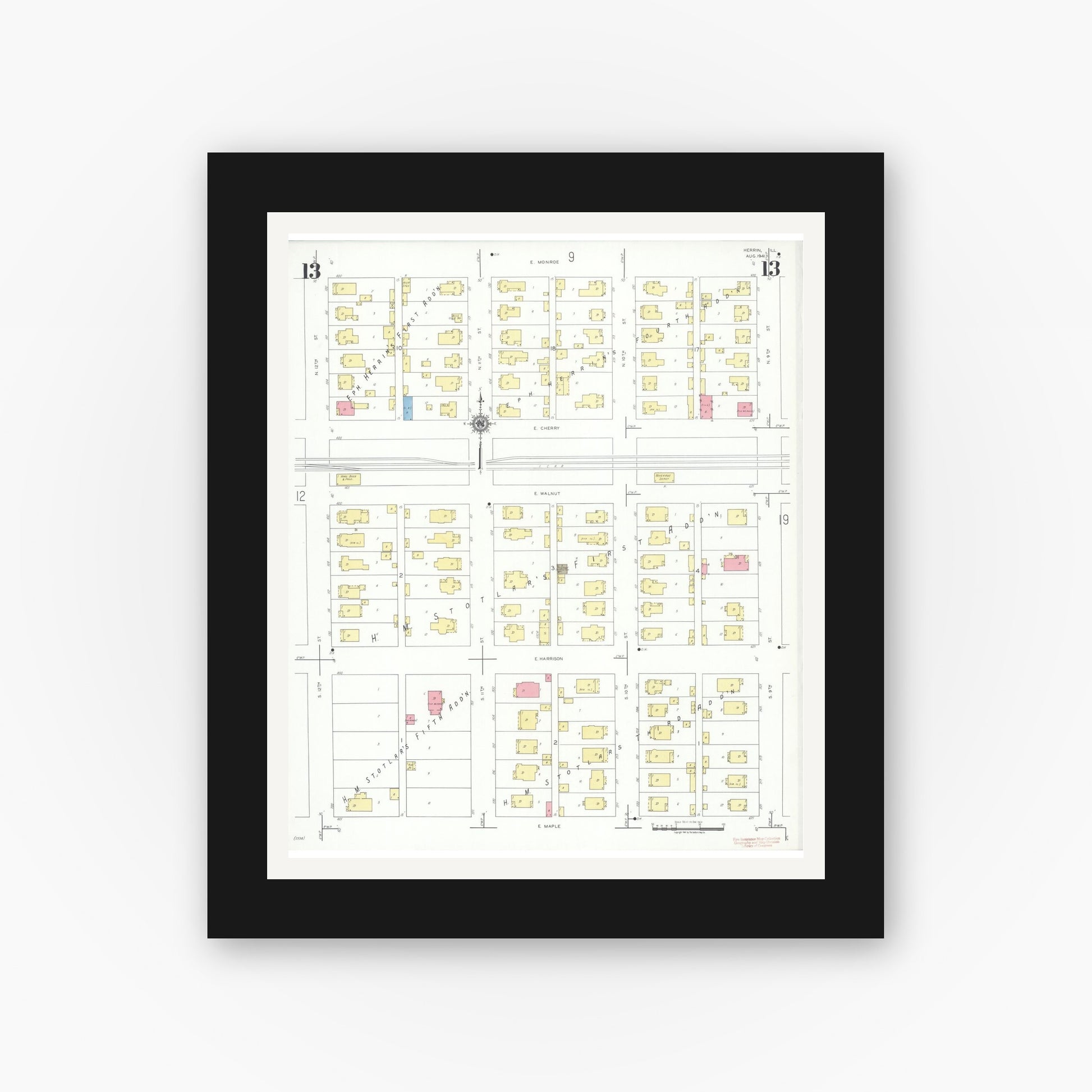 Old map wall art mockup — black gallery frame with white mat — Sanborn Fire Insurance Map from Herrin, Williamson County, Illinois (1941), Sheet #0013