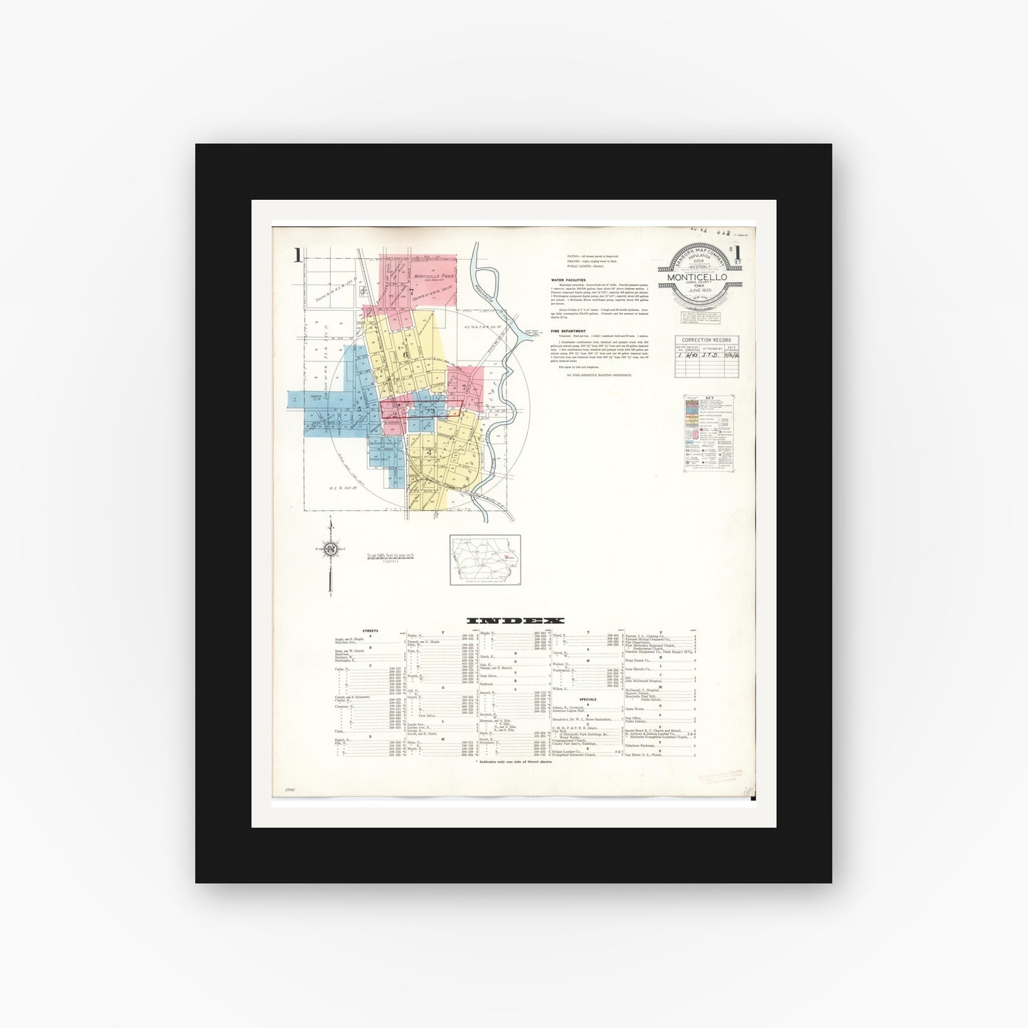 Old map wall art mockup — black gallery frame with white mat — Sanborn Fire Insurance Map from Monticello, Jones County, Iowa (1943) â€” Complete Set