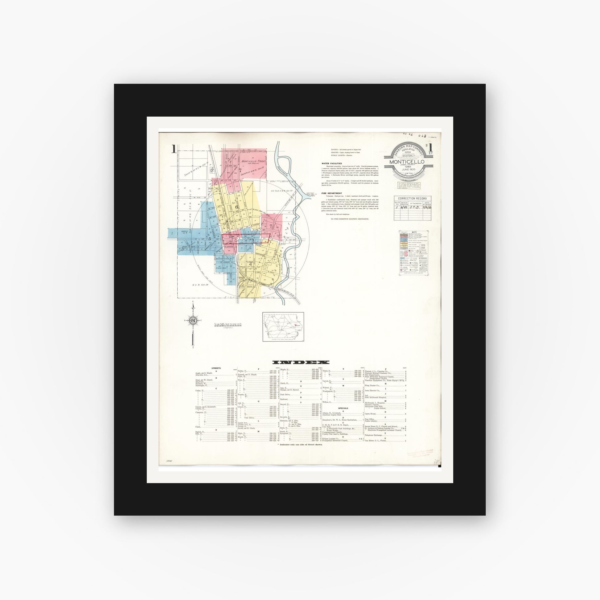 Old map wall art mockup — black gallery frame with white mat — Sanborn Fire Insurance Map from Monticello, Jones County, Iowa (1943) â€” Complete Set