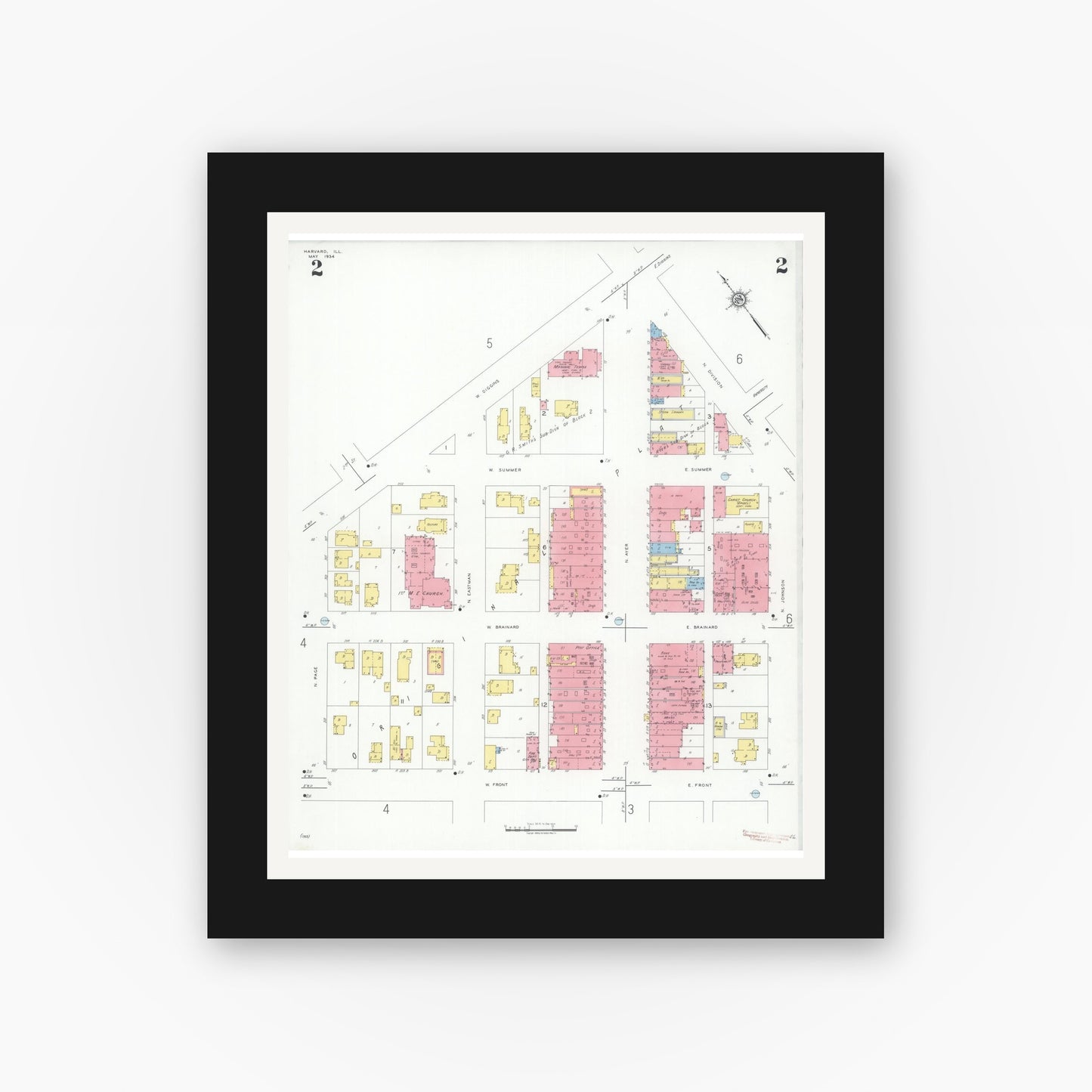 Old map wall art mockup — black gallery frame with white mat — Sanborn Fire Insurance Map from Harvard, McHenry County, Illinois (1934), Sheet #0002