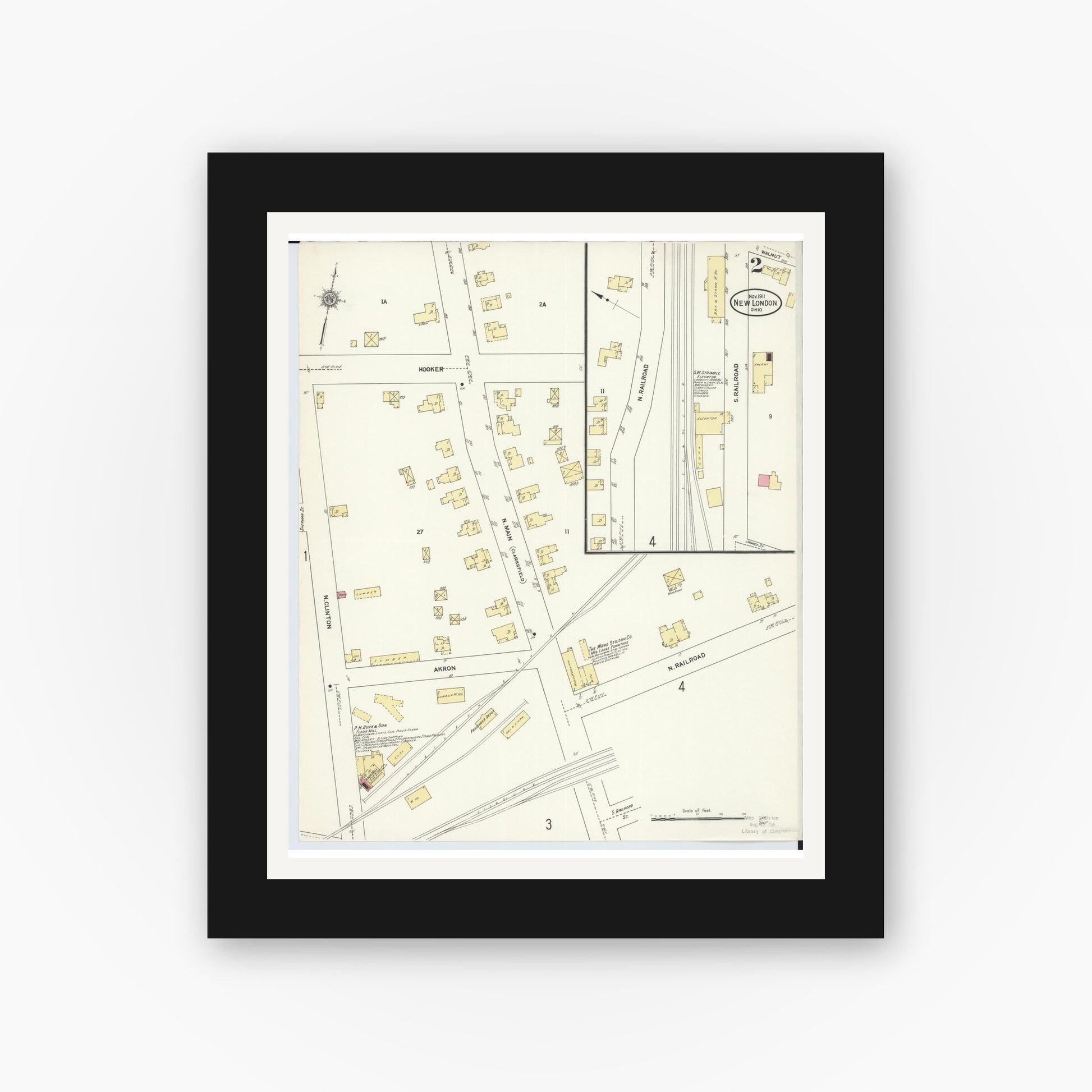 Old map wall art mockup — black gallery frame with white mat — Sanborn Fire Insurance Map from New London, Huron County, Ohio (1911), Sheet #0002