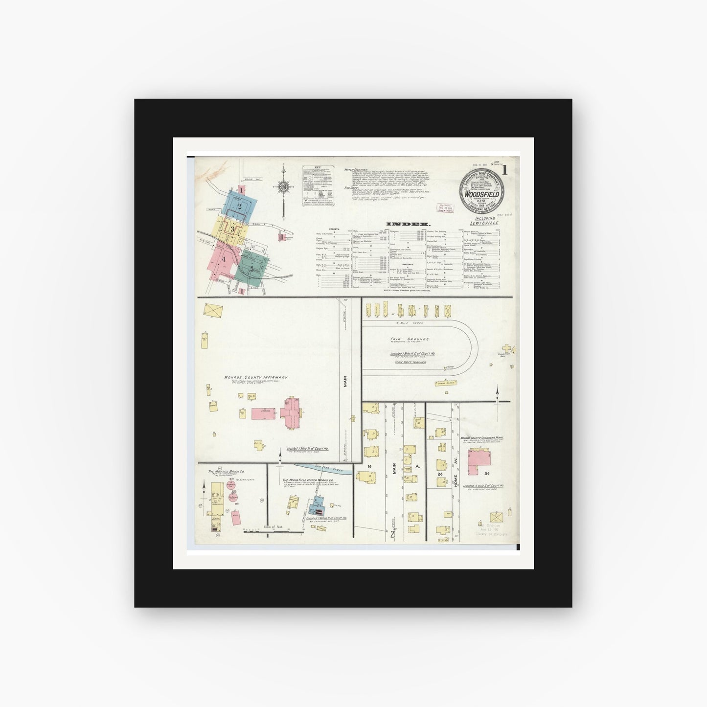 Old map wall art mockup — black gallery frame with white mat — Sanborn Fire Insurance Map from Woodsfield, Monroe County, Ohio (1911) - Complete Map Set