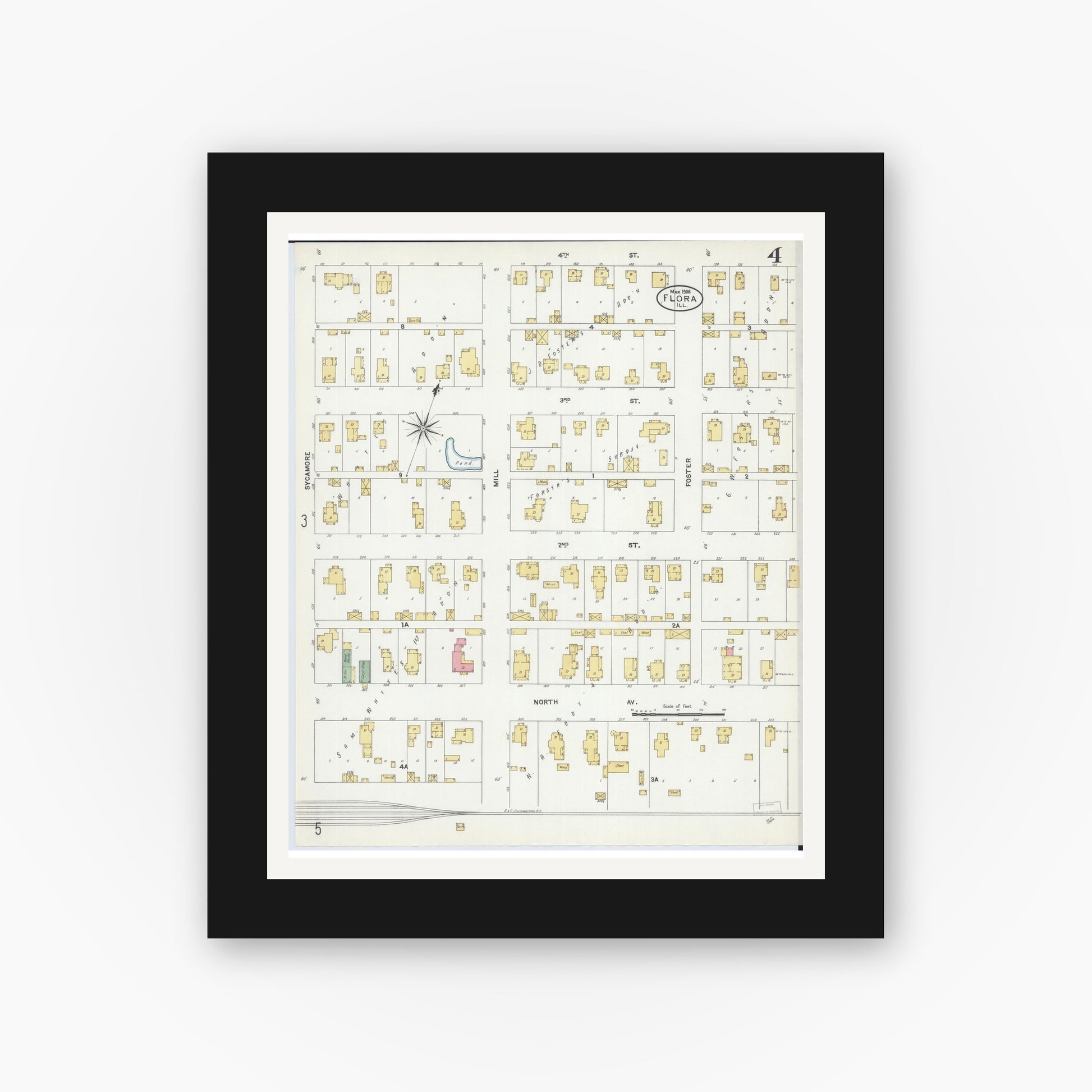 Old map wall art mockup — black gallery frame with white mat — Sanborn Fire Insurance Map from Flora, Clay County, Illinois (1906), Sheet #0004