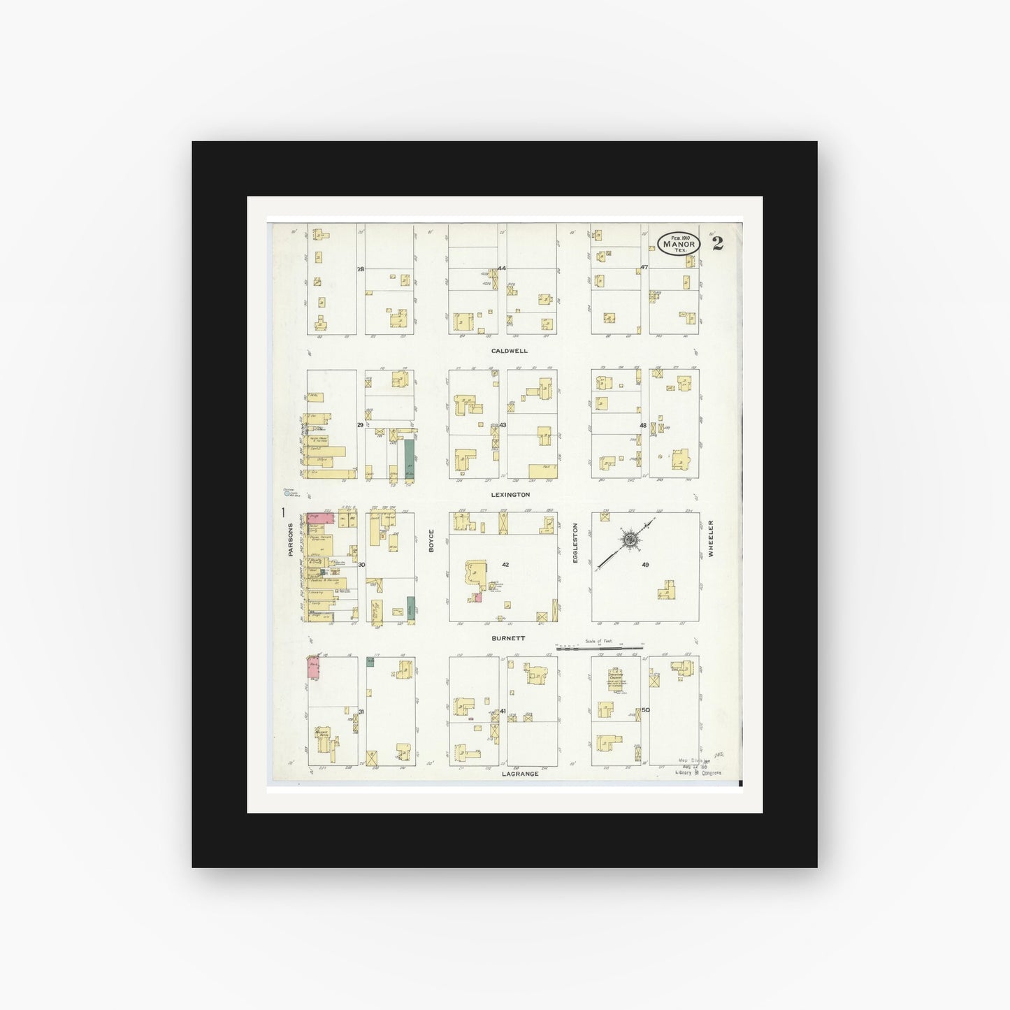 Old map wall art mockup — black gallery frame with white mat — Sanborn Fire Insurance Map from Manor, Travis County, Texas (1910), Sheet #0002