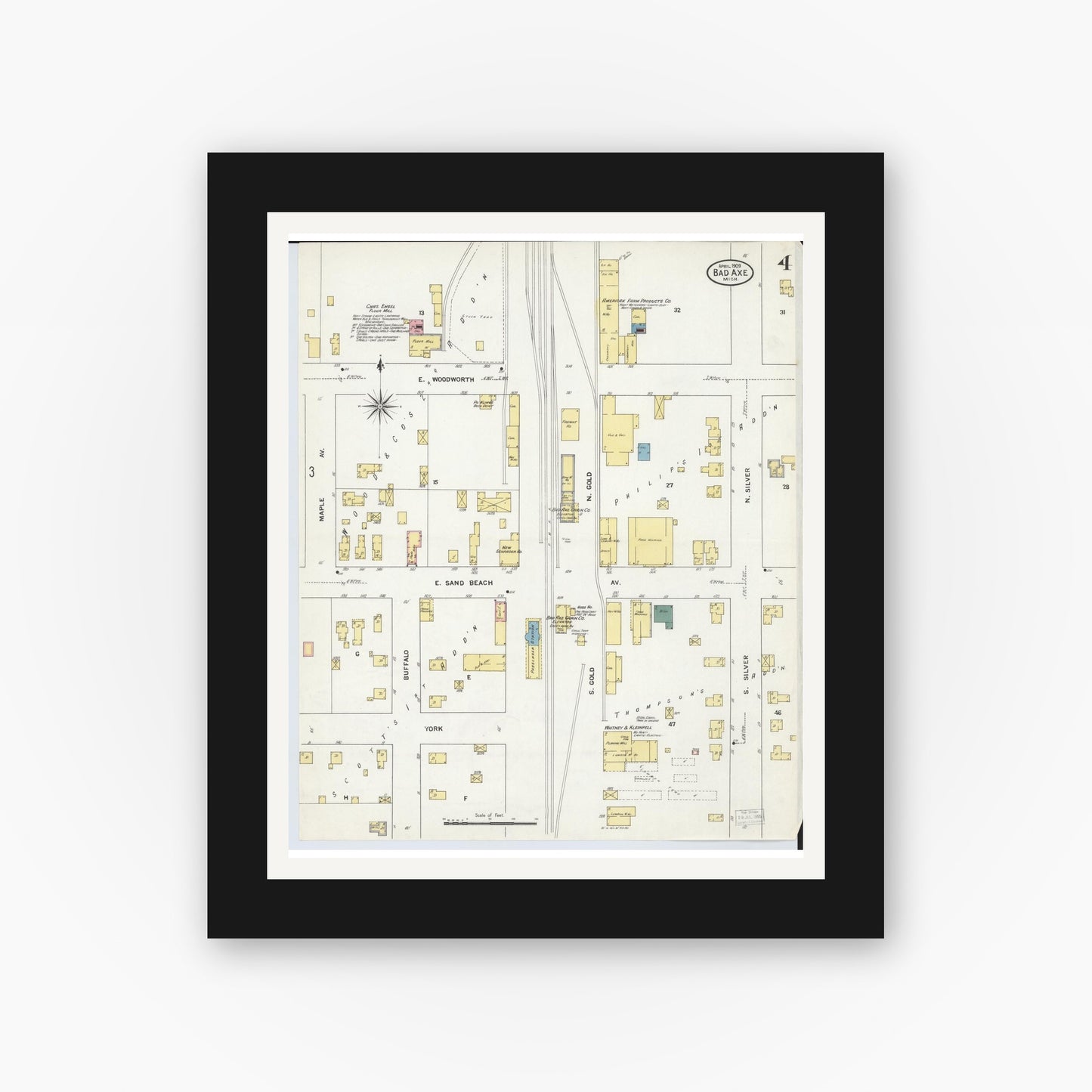 Old map wall art mockup — black gallery frame with white mat — Sanborn Fire Insurance Map from Bad Axe, Huron County, Michigan (1909), Sheet #0004