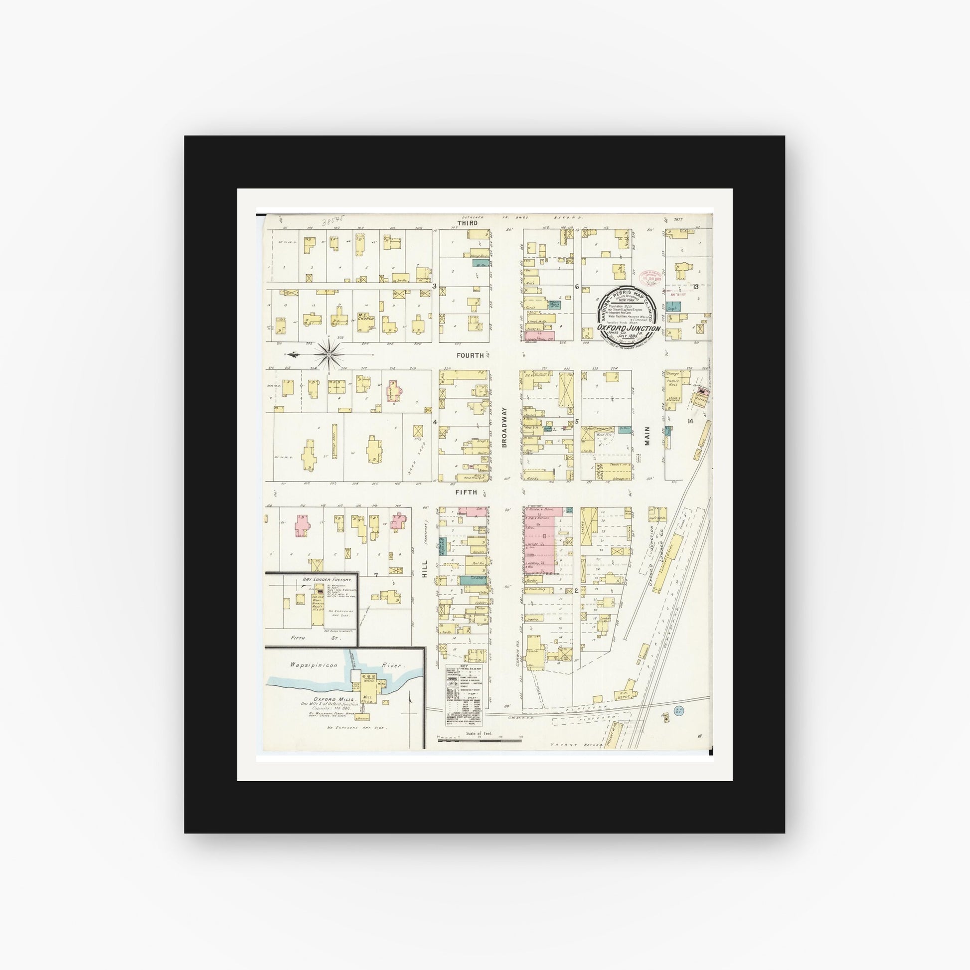 Old map wall art mockup — black gallery frame with white mat — Sanborn Fire Insurance Map from Oxford Junction, Jones County, Iowa (1895), Sheet #0001