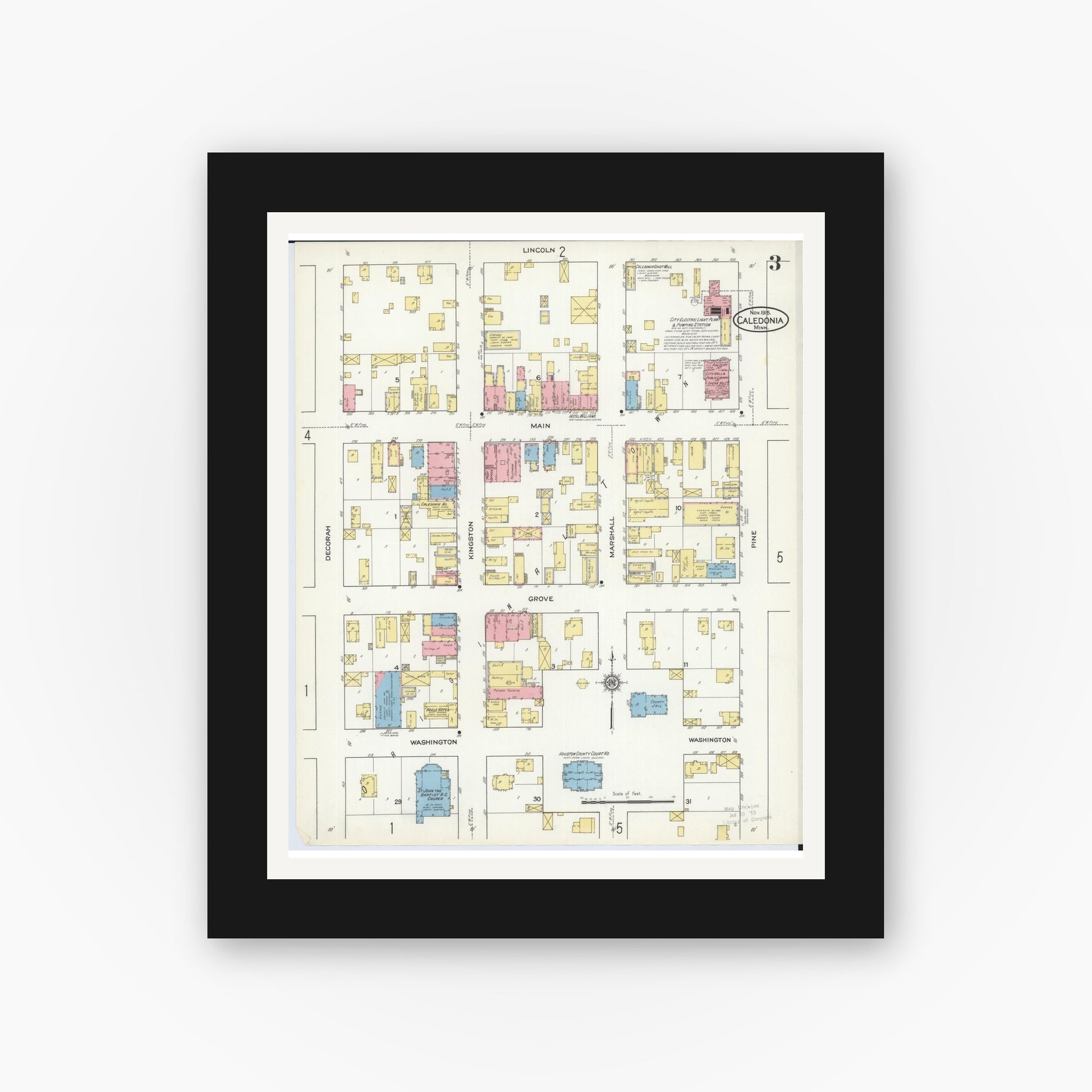 Old map wall art mockup — black gallery frame with white mat — Sanborn Fire Insurance Map from Caledonia, Houston County, Minnesota (1915), Sheet #0003