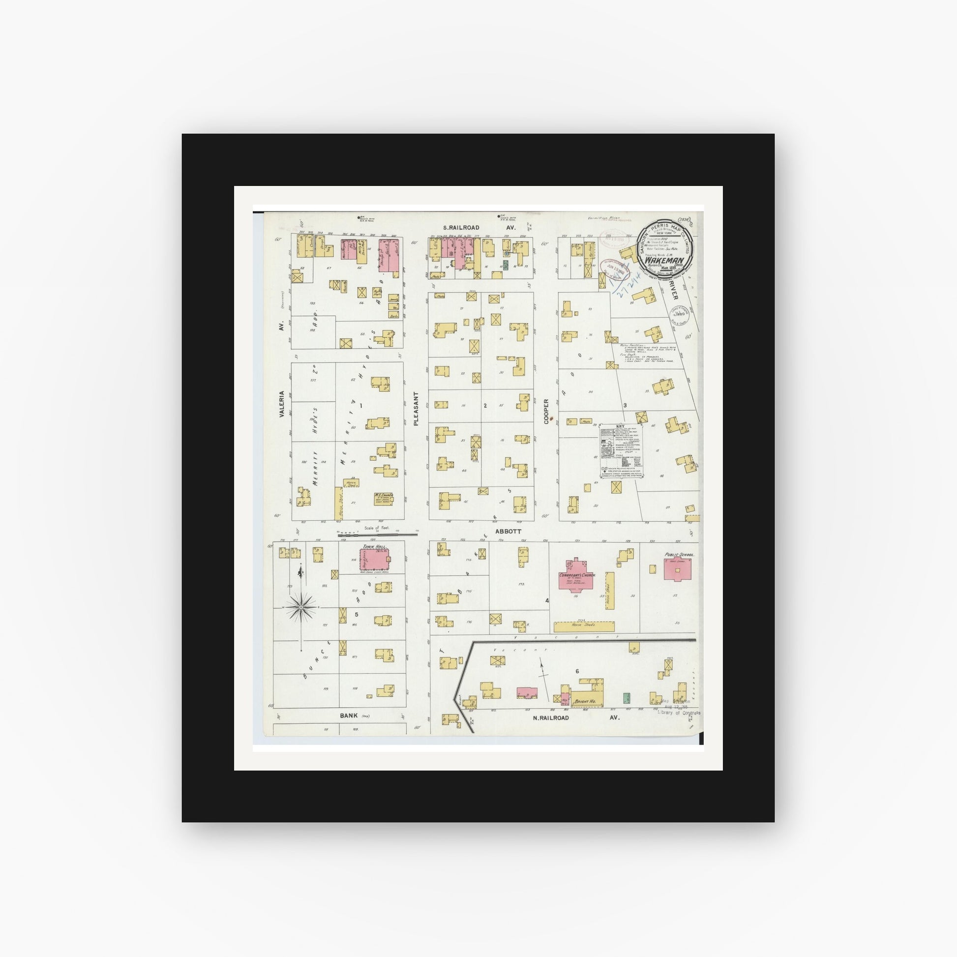 Old map wall art mockup — black gallery frame with white mat — Sanborn Fire Insurance Map from Wakeman, Huron County, Ohio (1899), Sheet #0001
