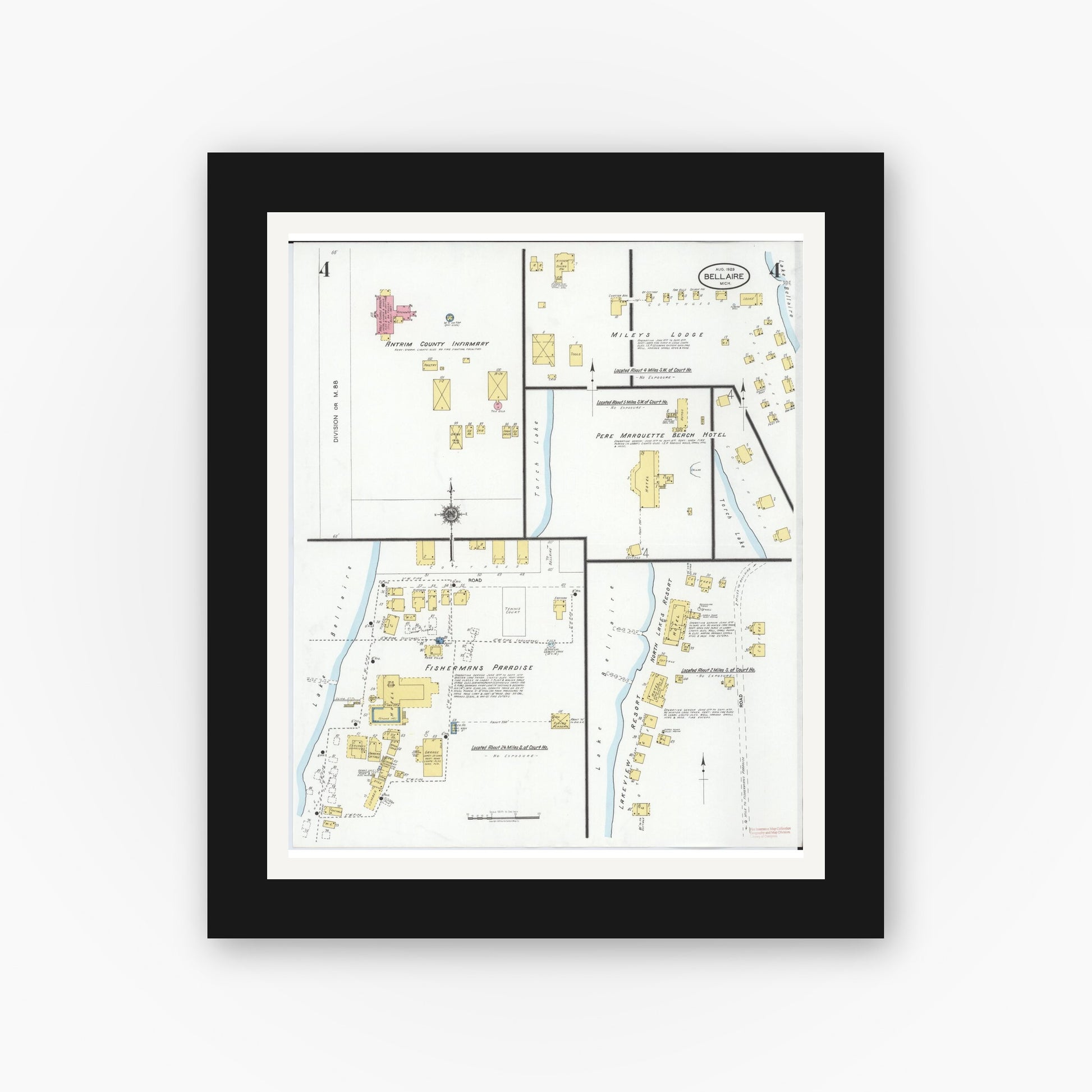 Old map wall art mockup — black gallery frame with white mat — Sanborn Fire Insurance Map from Bellaire, Antrim County, Michigan (1929), Sheet #0004