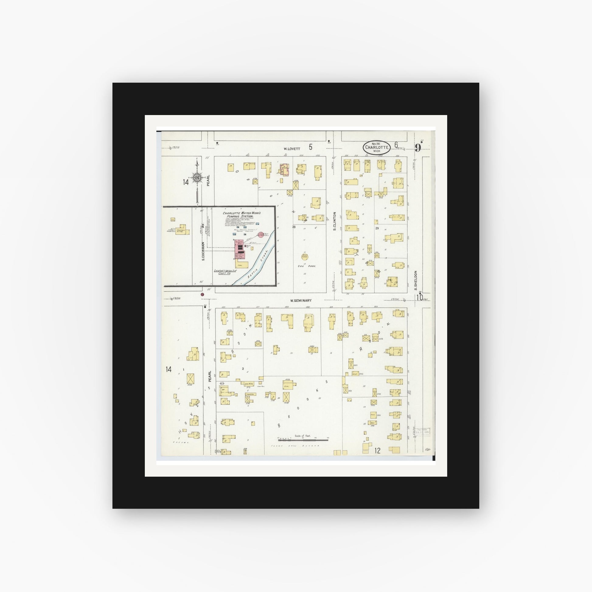 Old map wall art mockup — black gallery frame with white mat — Sanborn Fire Insurance Map from Charlotte, Eaton County, Michigan (1911), Sheet #0009