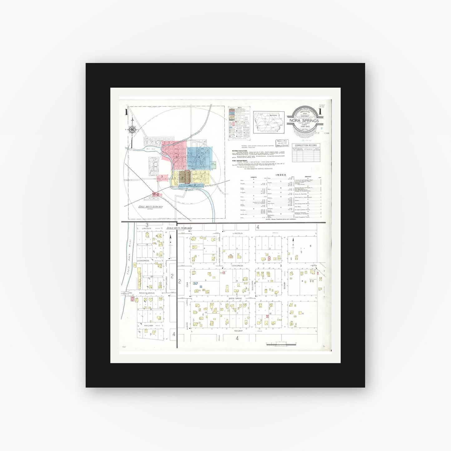 Old map wall art mockup — black gallery frame with white mat — Sanborn Fire Insurance Map from Nora Springs, Floyd County, Iowa (1942) â€” Complete Set