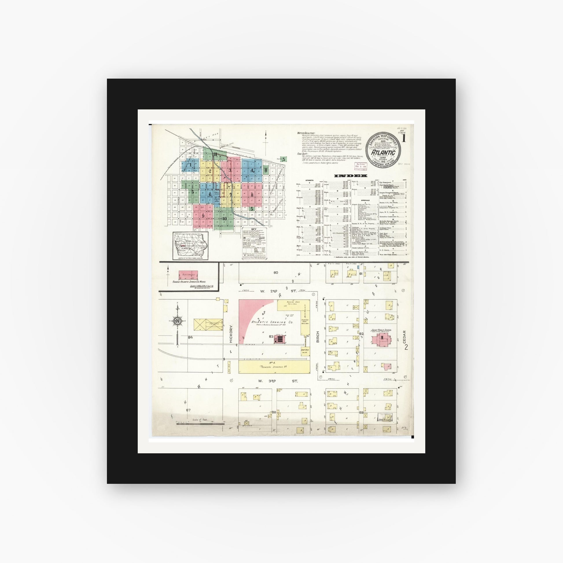 Old map wall art mockup — black gallery frame with white mat — Sanborn Fire Insurance Map from Atlantic, Cass County, Iowa (1913) â€” Complete Set