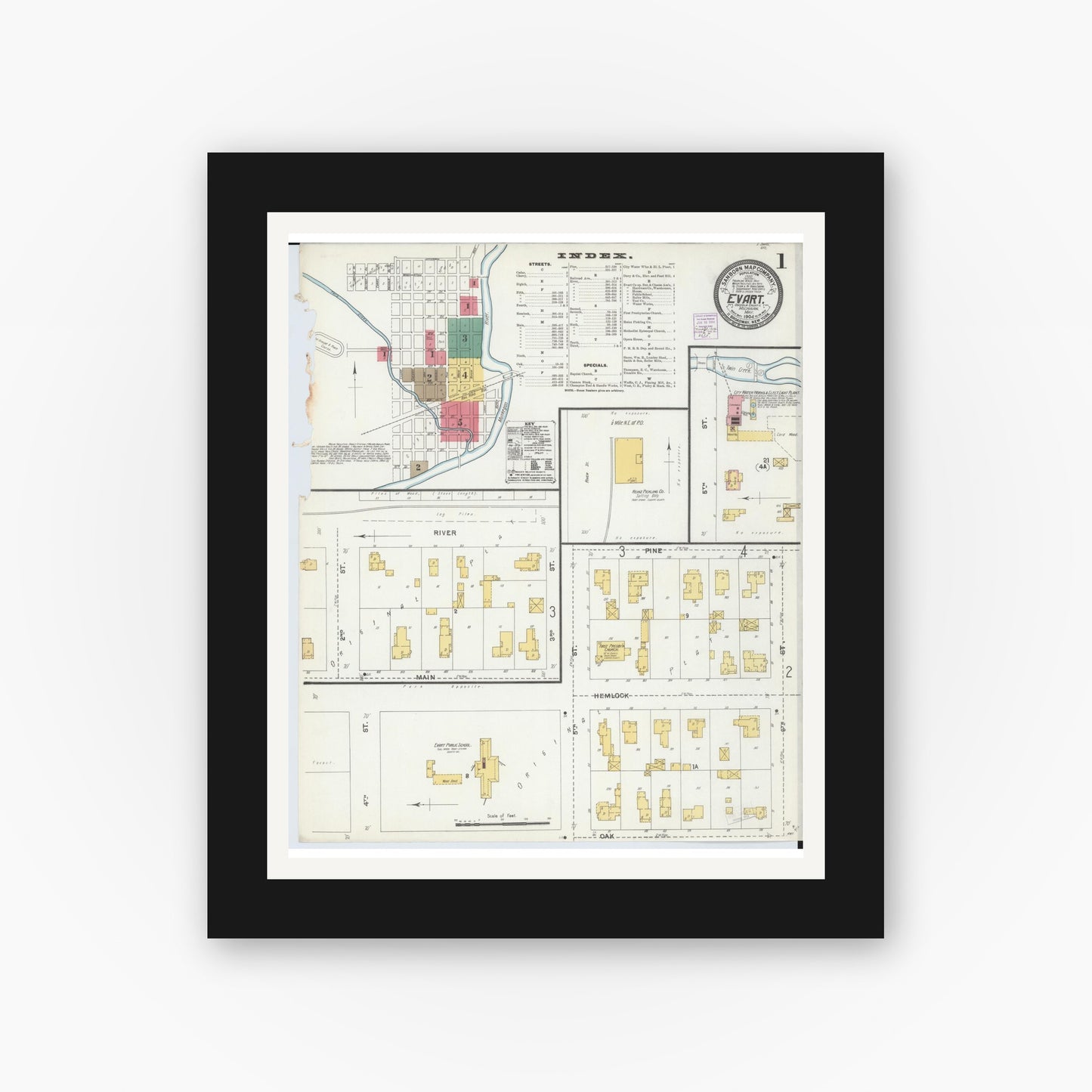 Old map wall art mockup — black gallery frame with white mat — Sanborn Fire Insurance Map from Evart, Osceola County, Michigan (1904), Sheet #0001