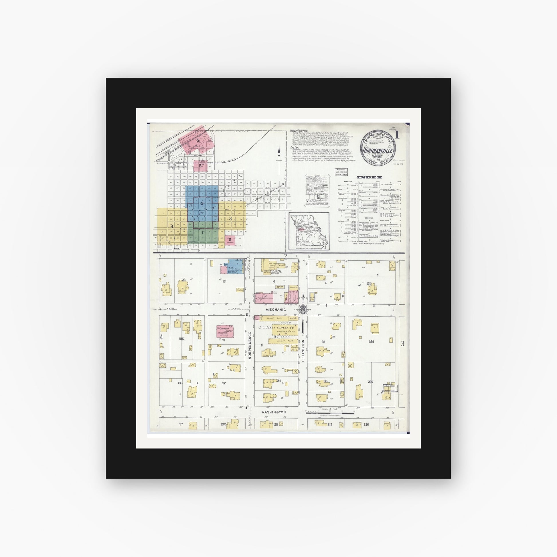 Old map wall art mockup — black gallery frame with white mat — Sanborn Fire Insurance Map from Harrisonville, Cass County, Missouri (1918), Sheet #0001