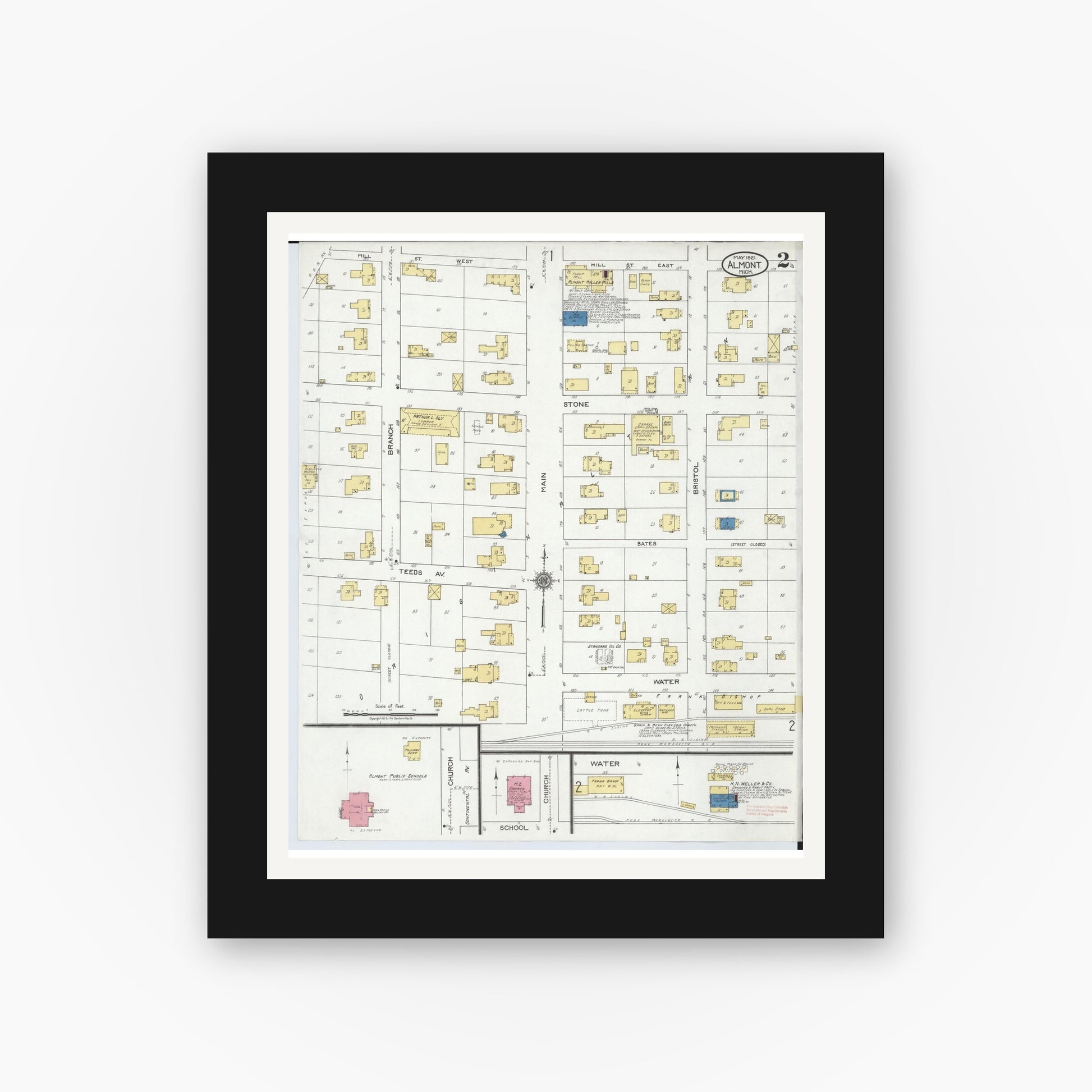 Old map wall art mockup — black gallery frame with white mat — Sanborn Fire Insurance Map from Almont, Lapeer County, Michigan (1921), Sheet #0002