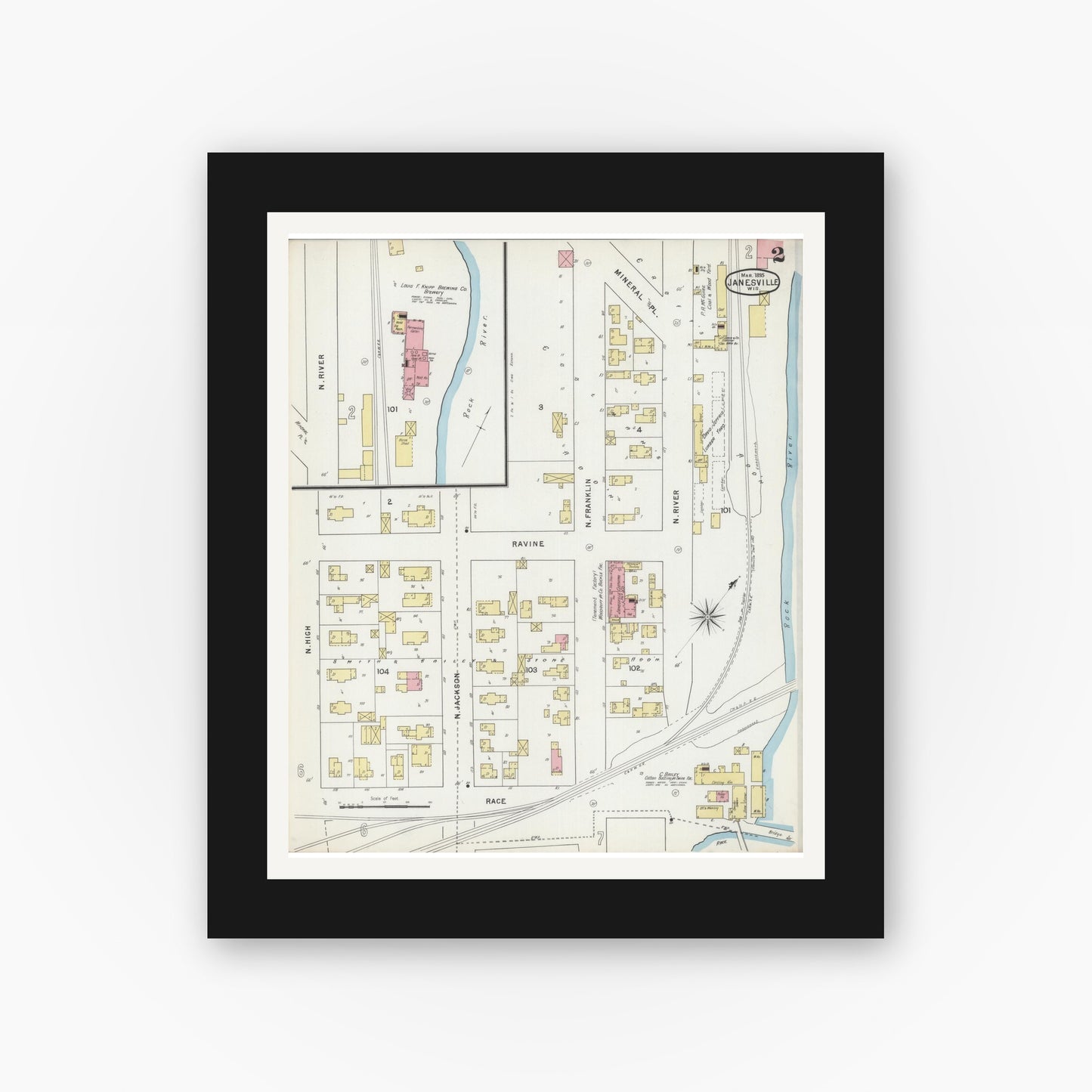 Old map wall art mockup — black gallery frame with white mat — Sanborn Fire Insurance Map from Janesville, Rock County, Wisconsin (1895), Sheet #0002