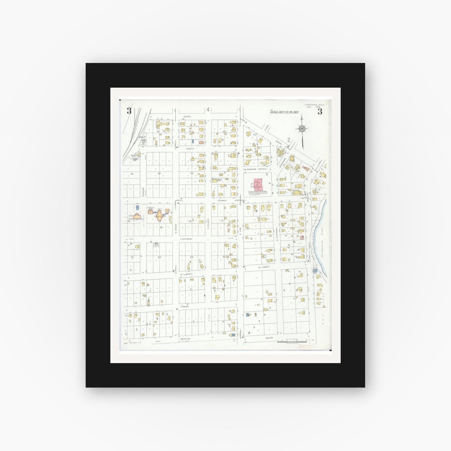 Old map wall art mockup — black gallery frame with white mat — Sanborn Fire Insurance Map from Chesaning, Saginaw County, Michigan (1935), Sheet #0003