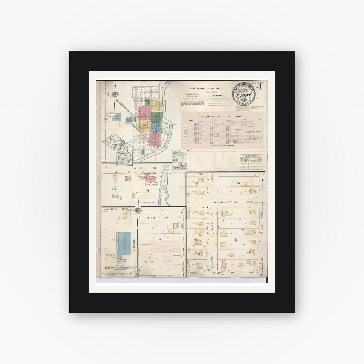 Old map wall art mockup — black gallery frame with white mat — Sanborn Fire Insurance Map from Evart, Osceola County, Michigan (1942), Sheet #0001