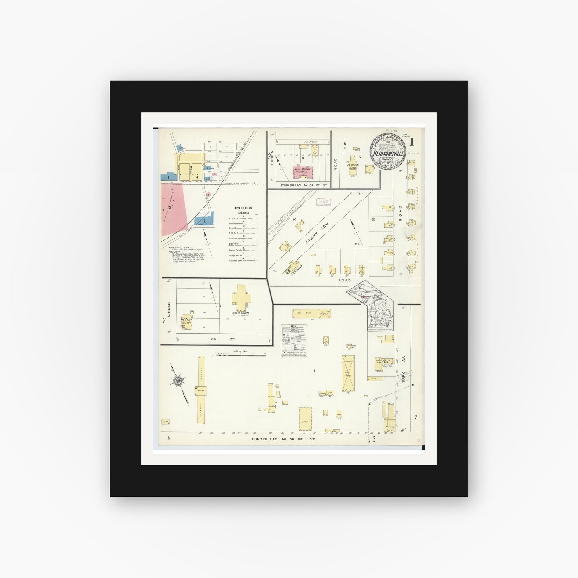 Old map wall art mockup — black gallery frame with white mat — Sanborn Fire Insurance Map from Hermansville, Menominee County, Michigan (1913), Sheet #0001