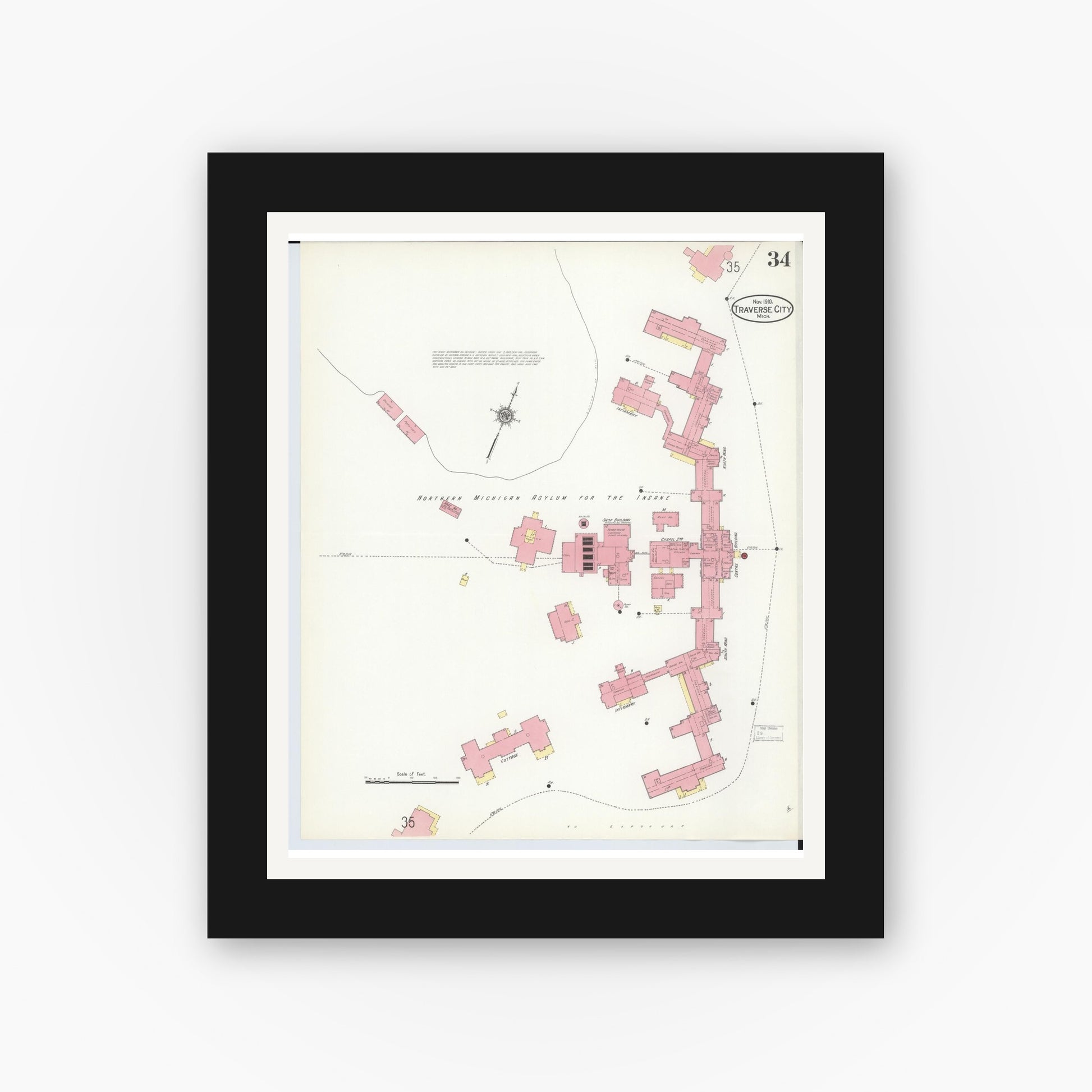Old map wall art mockup — black gallery frame with white mat — Sanborn Fire Insurance Map from Traverse City, Grand Traverse County, Michigan (1910), Sheet #0034