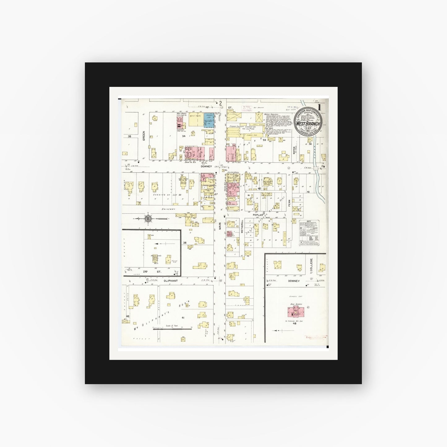 Old map wall art mockup — black gallery frame with white mat — Sanborn Fire Insurance Map from West Branch, Cedar County, Iowa (1912) â€” Complete Set
