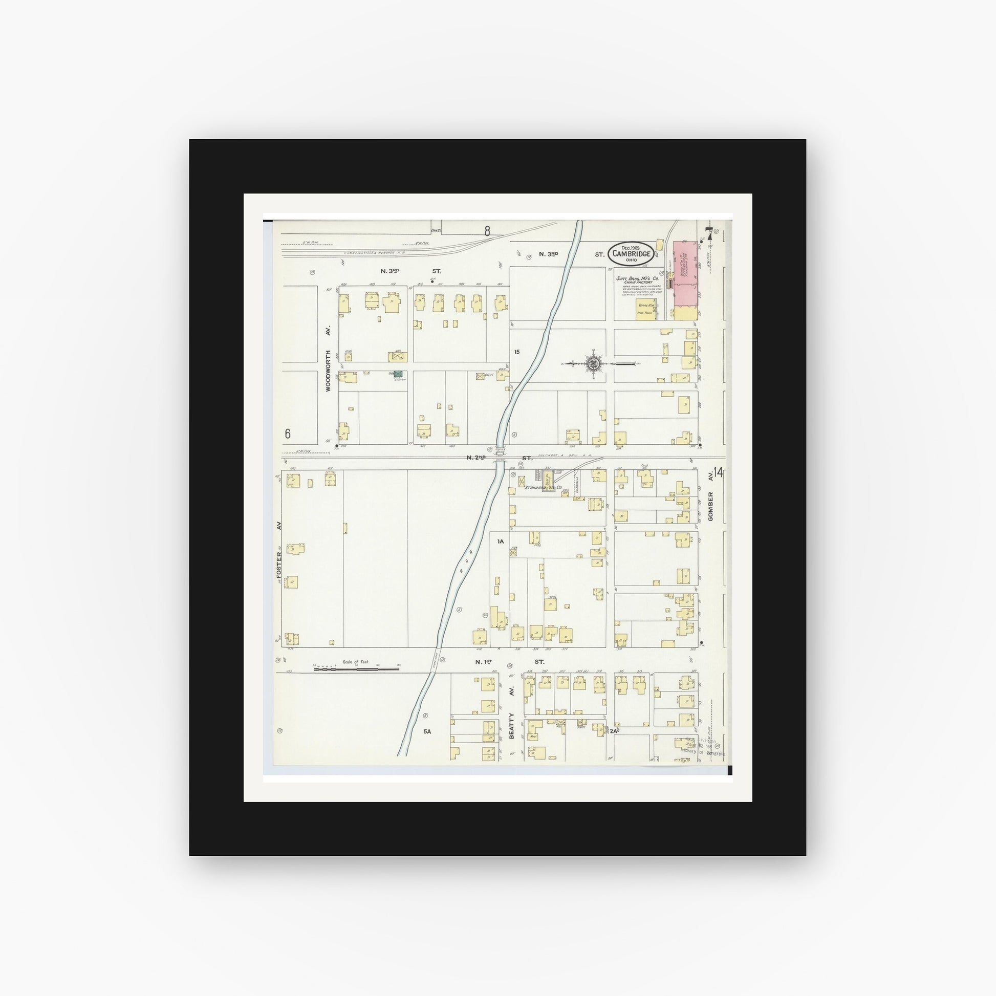 Old map wall art mockup — black gallery frame with white mat — Sanborn Fire Insurance Map from Cambridge, Guernsey County, Ohio (1909), Sheet #0007