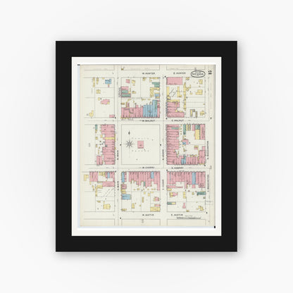 Old map wall art mockup — black gallery frame with white mat — Sanborn Fire Insurance Map from Nevada, Vernon County, Missouri (1894), Sheet #0002