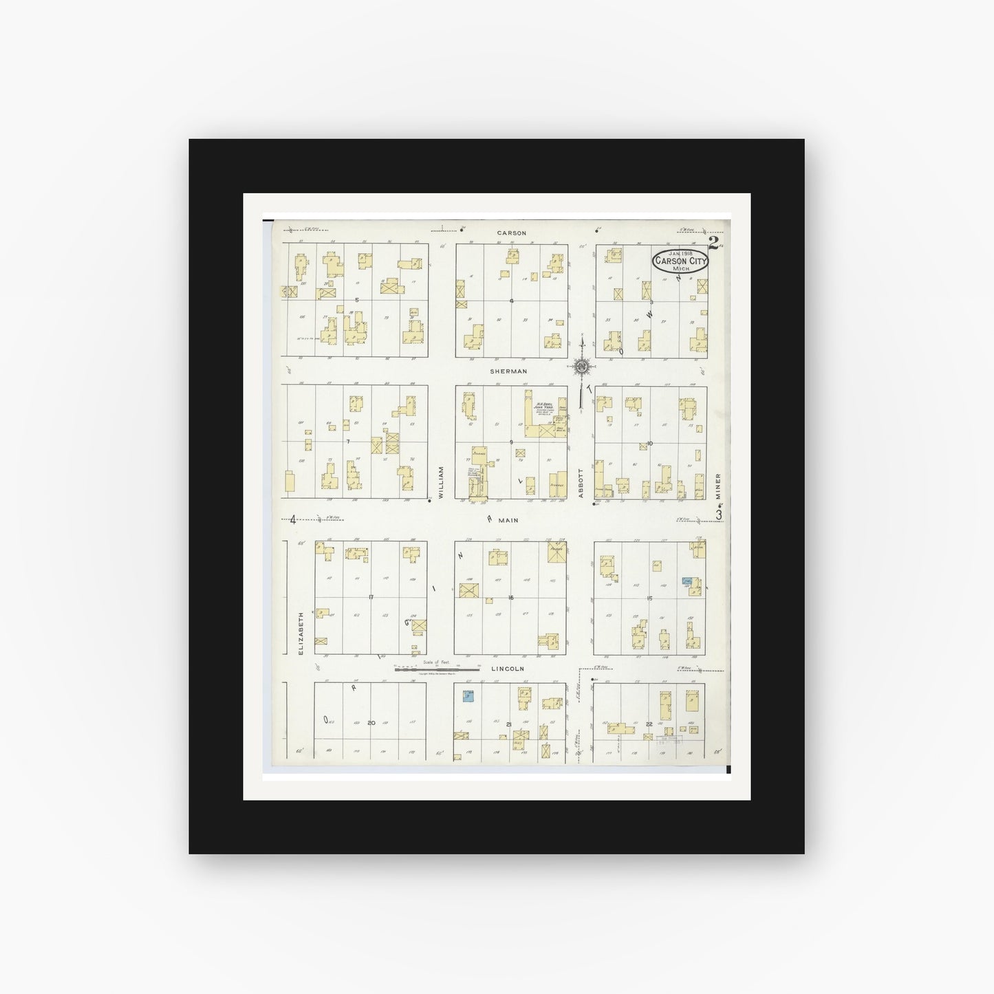 Old map wall art mockup — black gallery frame with white mat — Sanborn Fire Insurance Map from Carson City, Montcalm County, Michigan (1918), Sheet #0002