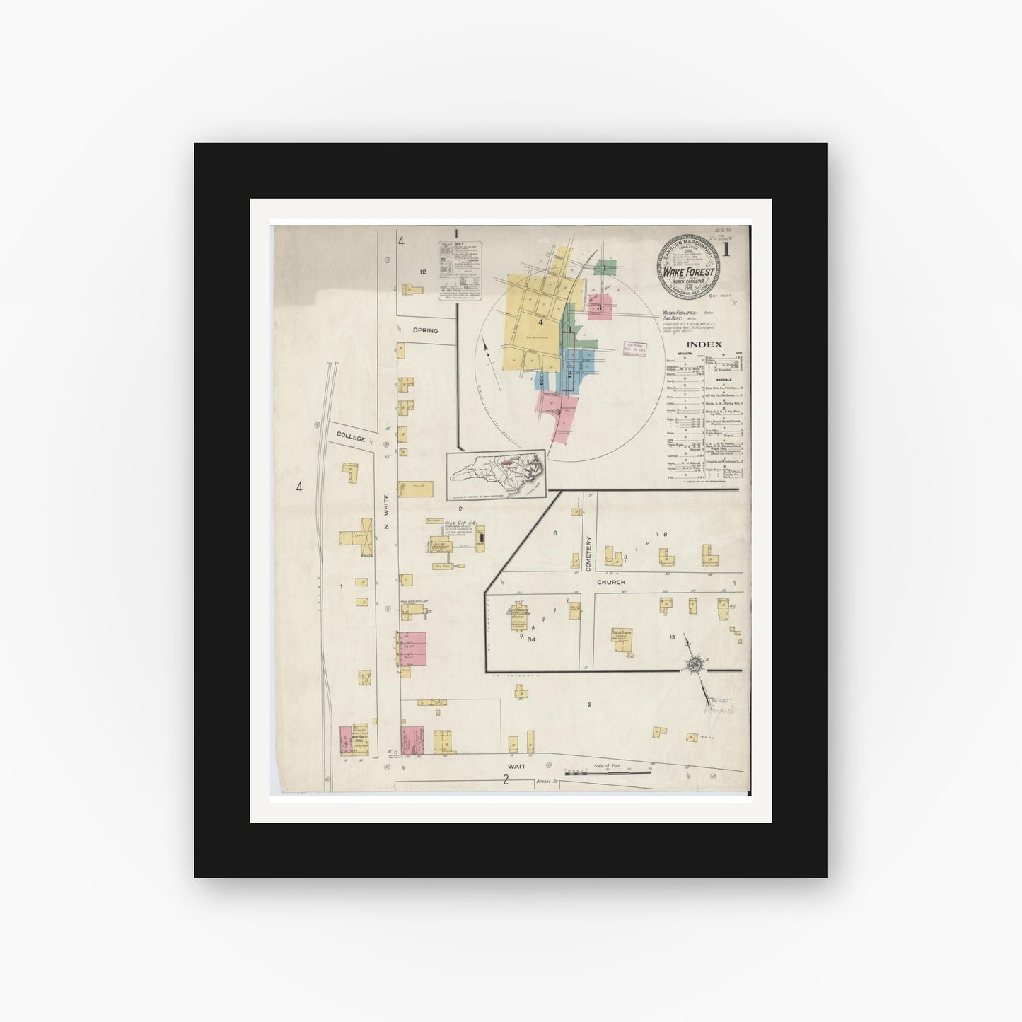 Old map wall art mockup — black gallery frame with white mat — Sanborn Fire Insurance Map from Wake Forest, Wake County, North Carolina (1915) - Complete Map Set