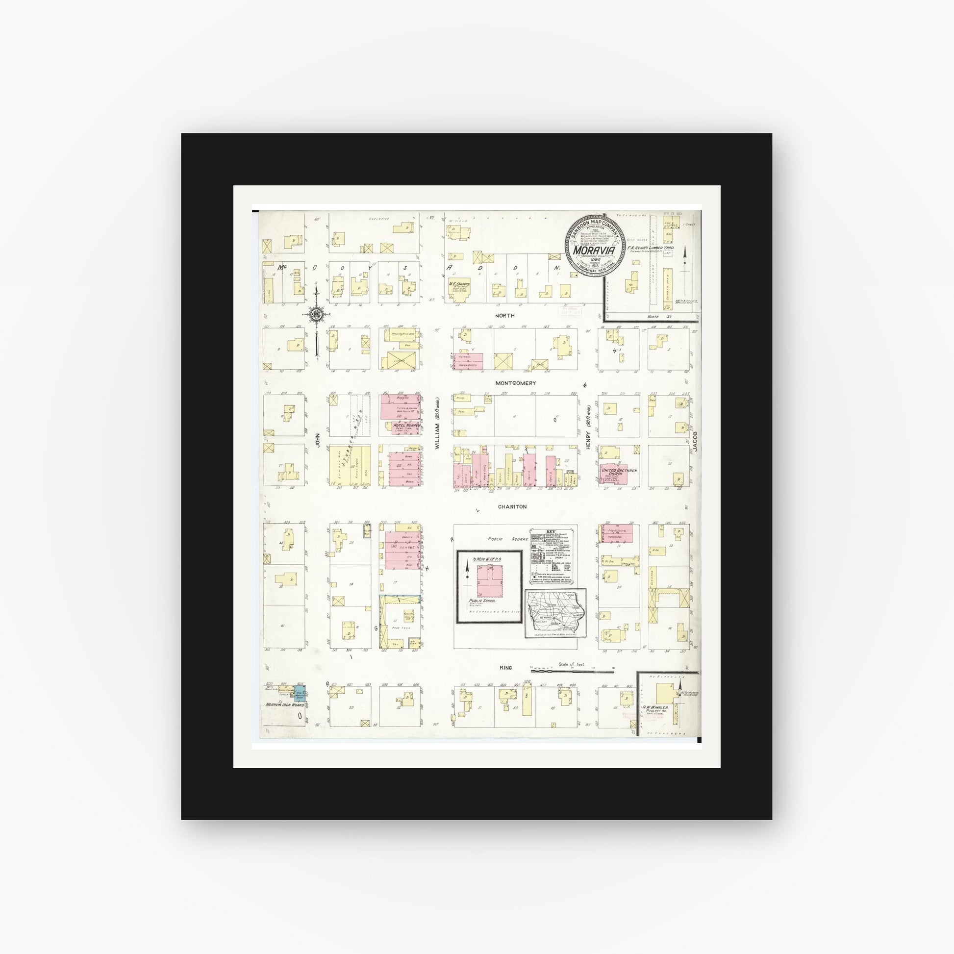 Old map wall art mockup — black gallery frame with white mat — Sanborn Fire Insurance Map from Moravia, Appanoose County, Iowa (1913), Sheet #0001