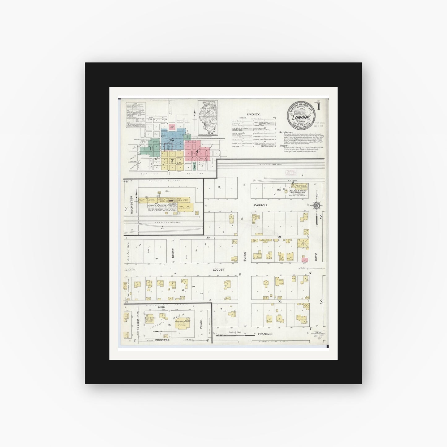Old map wall art mockup — black gallery frame with white mat — Sanborn Fire Insurance Map from Lanark, Carroll County, Illinois (1912), Sheet #0001