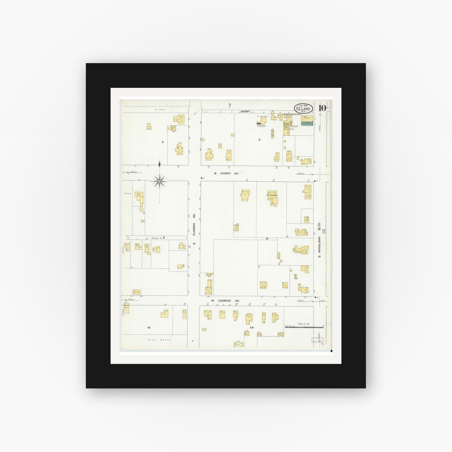 Old map wall art mockup — black gallery frame with white mat — Sanborn Fire Insurance Map from De Land, Volusia County, Florida (1909), Sheet #0010