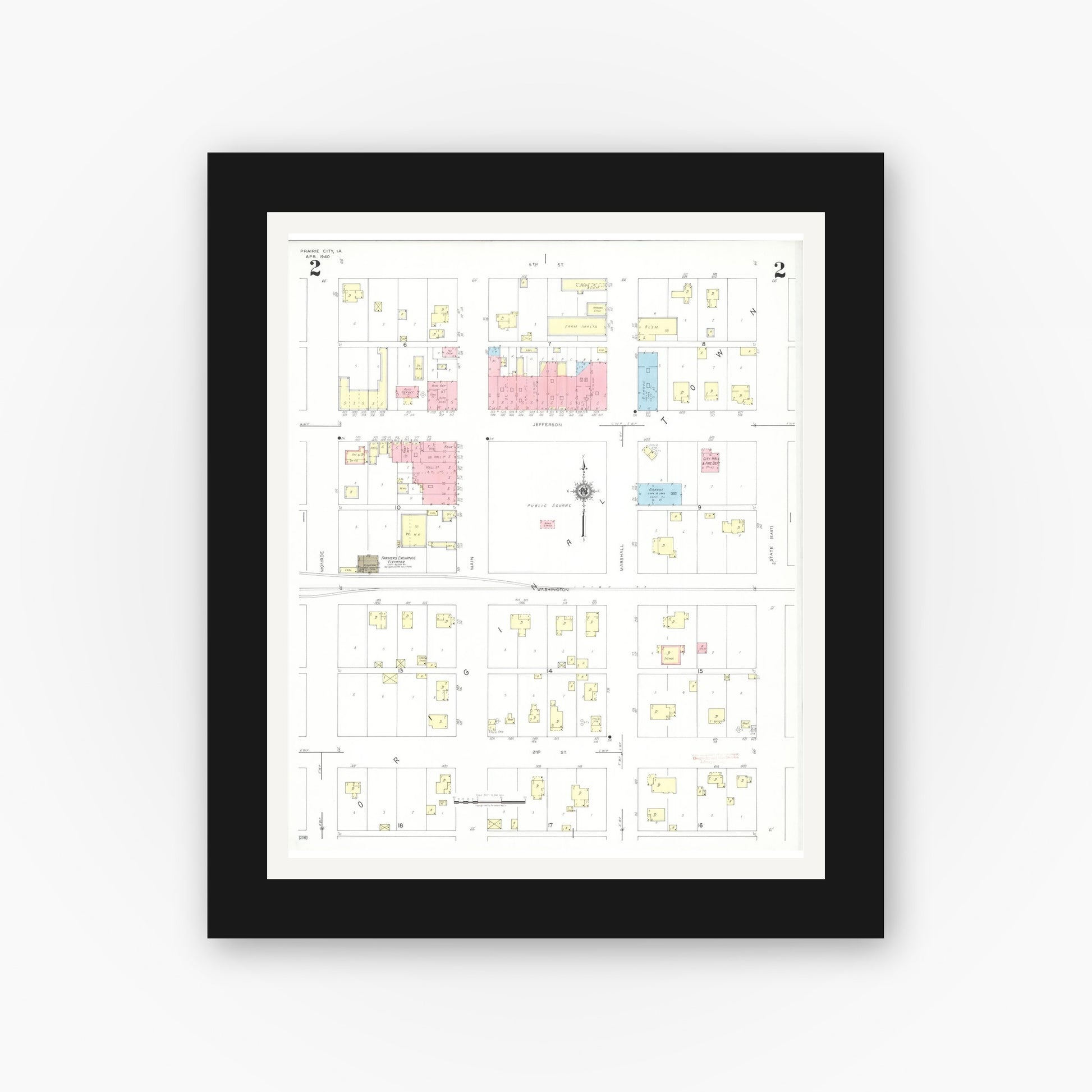 Old map wall art mockup — black gallery frame with white mat — Sanborn Fire Insurance Map from Prairie City, Jasper County, Iowa (1940), Sheet #0002