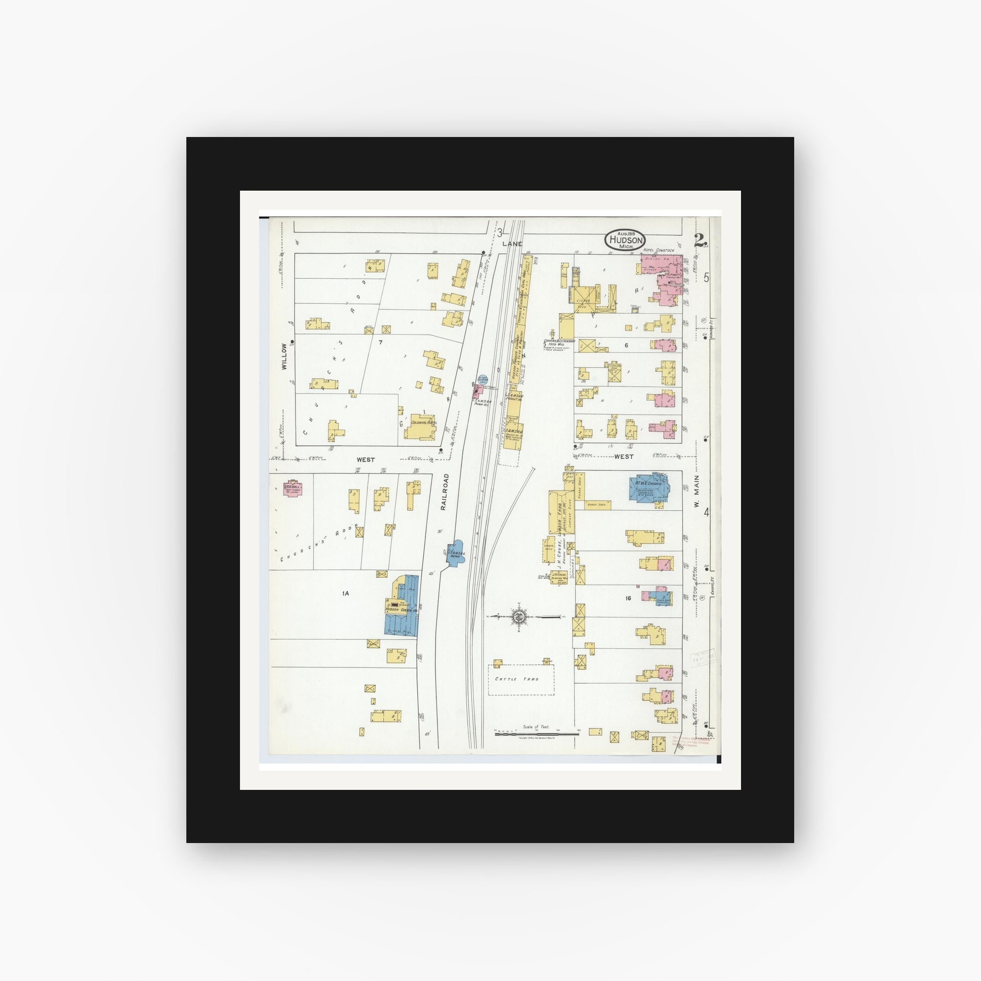 Old map wall art mockup — black gallery frame with white mat — Sanborn Fire Insurance Map from Hudson, Lenawee County, Michigan (1919), Sheet #0002