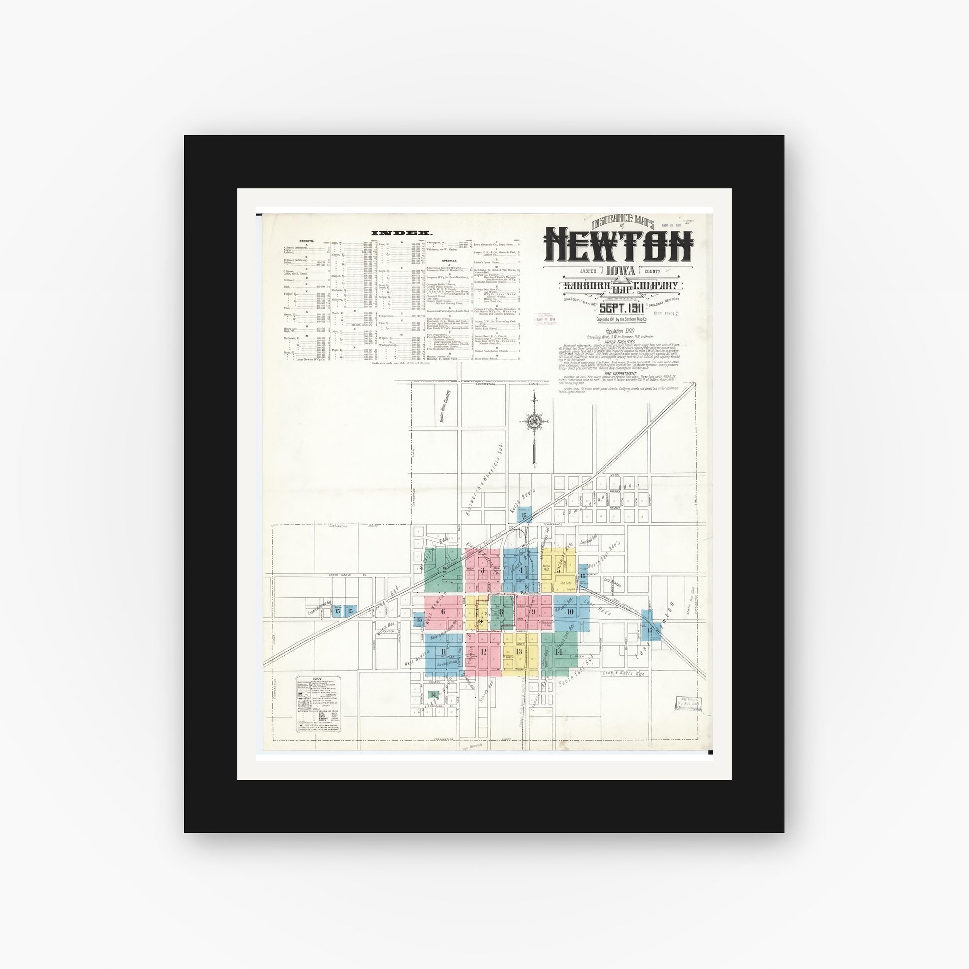 Old map wall art mockup — black gallery frame with white mat — Sanborn Fire Insurance Map from Newton, Jasper County, Iowa (1911) â€” Complete Set