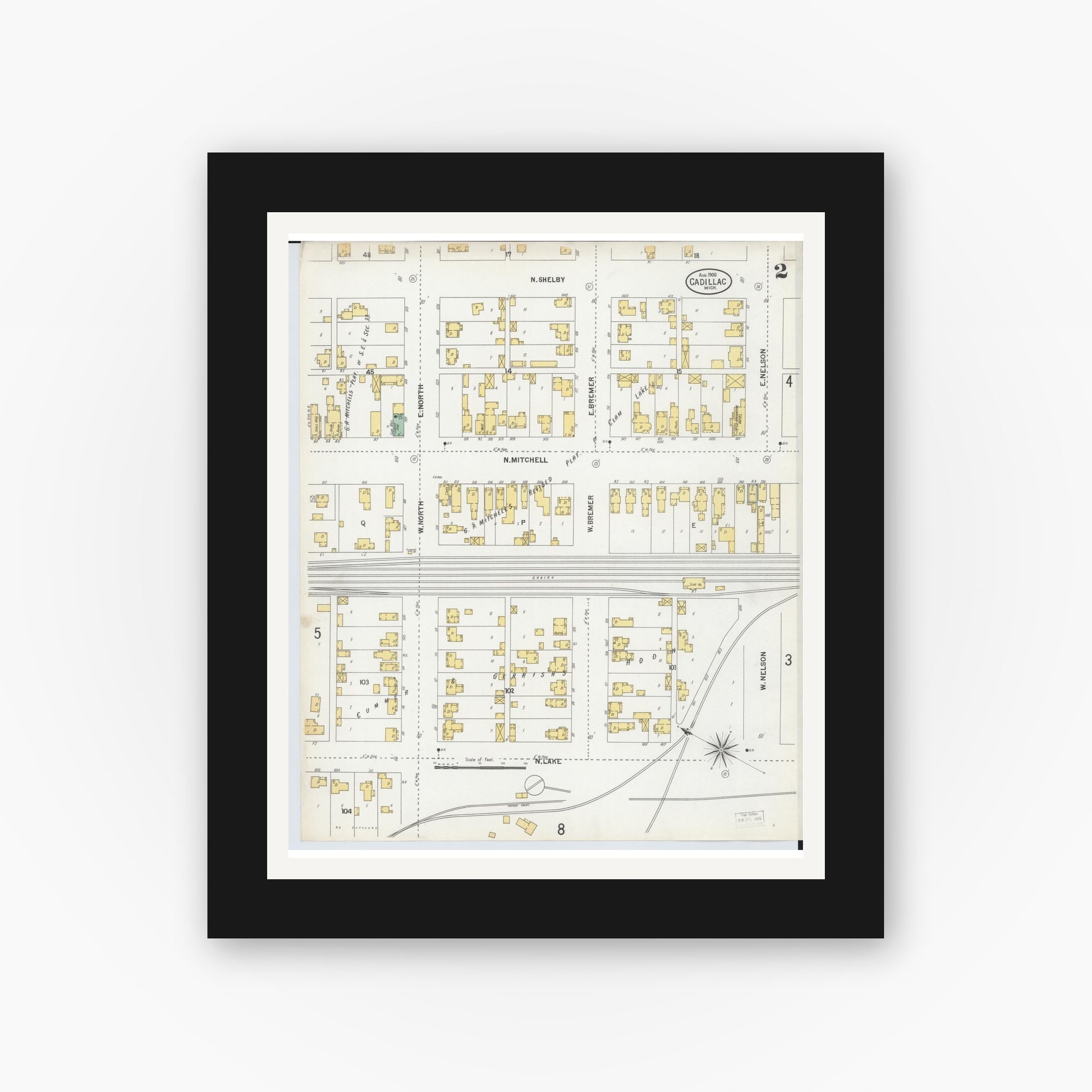 Old map wall art mockup — black gallery frame with white mat — Sanborn Fire Insurance Map from Cadillac, Wexford County, Michigan (1900), Sheet #0002