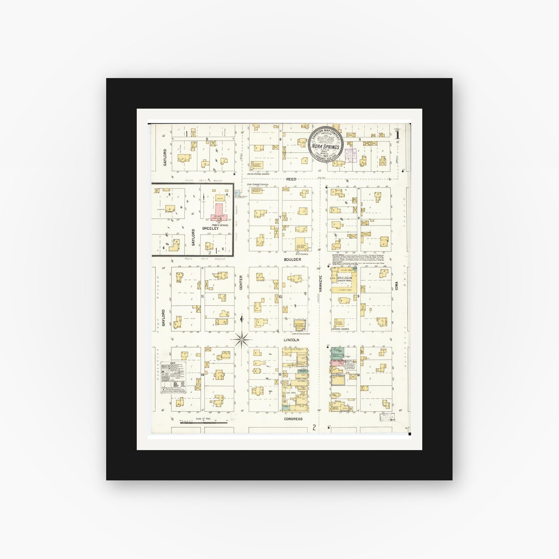 Old map wall art mockup — black gallery frame with white mat — Sanborn Fire Insurance Map from Nora Springs, Floyd County, Iowa (1902) â€” Complete Set