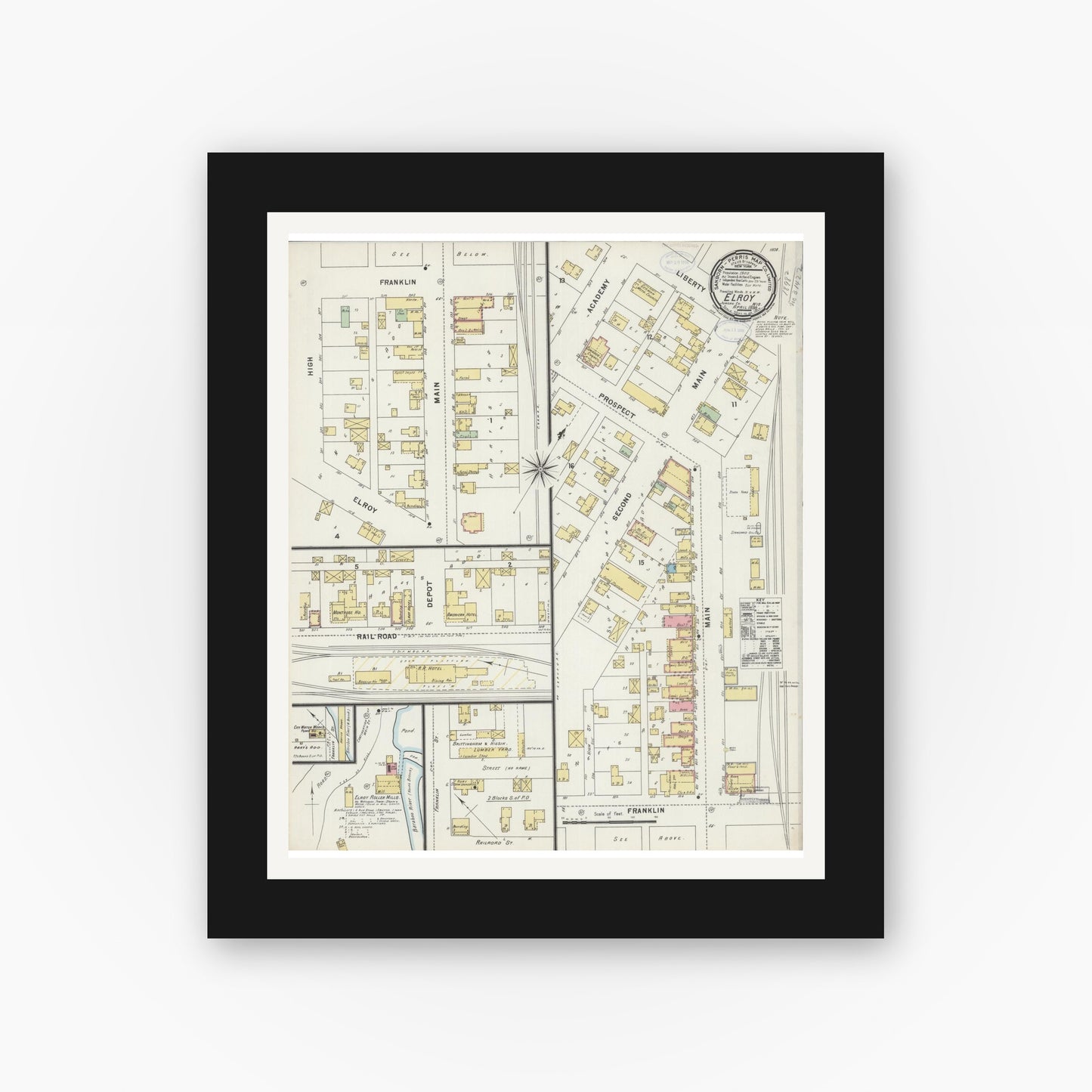 Old map wall art mockup — black gallery frame with white mat — Sanborn Fire Insurance Map from Elroy, Juneau County, Wisconsin (1898), Sheet #0001