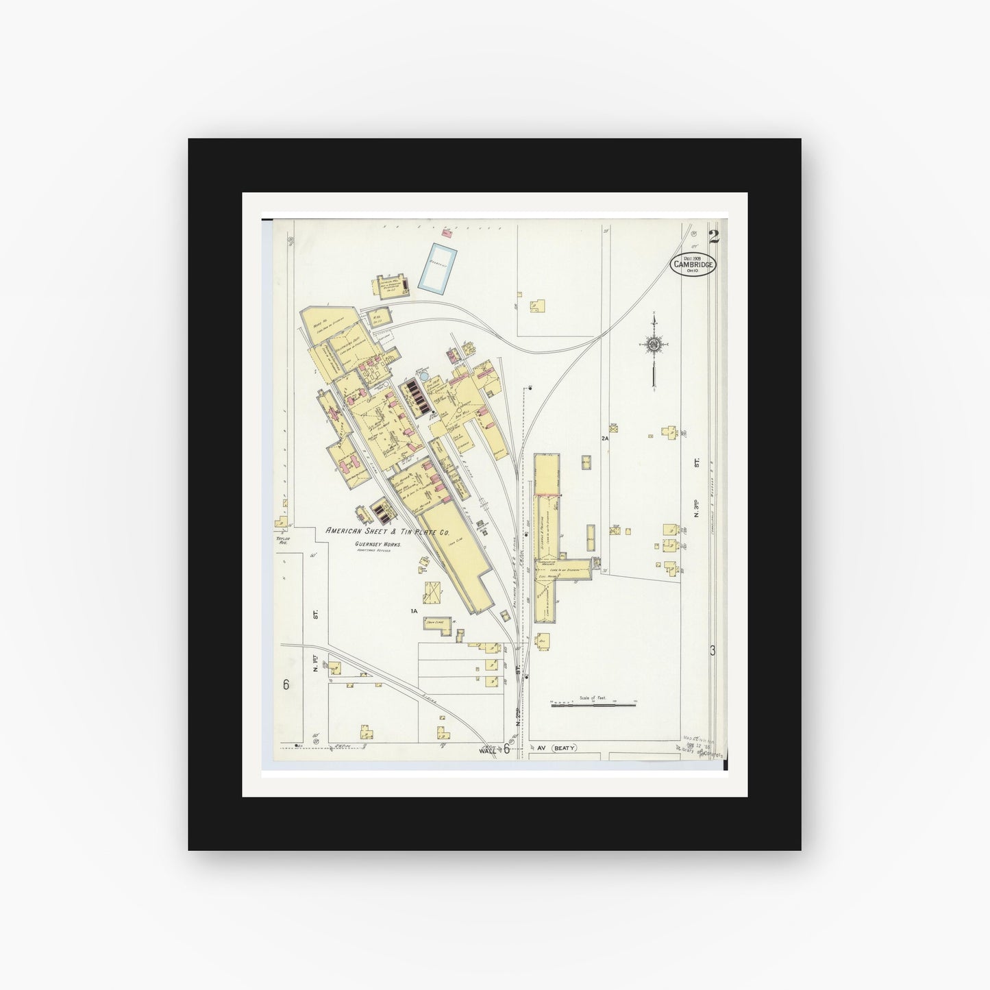 Old map wall art mockup — black gallery frame with white mat — Sanborn Fire Insurance Map from Cambridge, Guernsey County, Ohio (1909), Sheet #0002