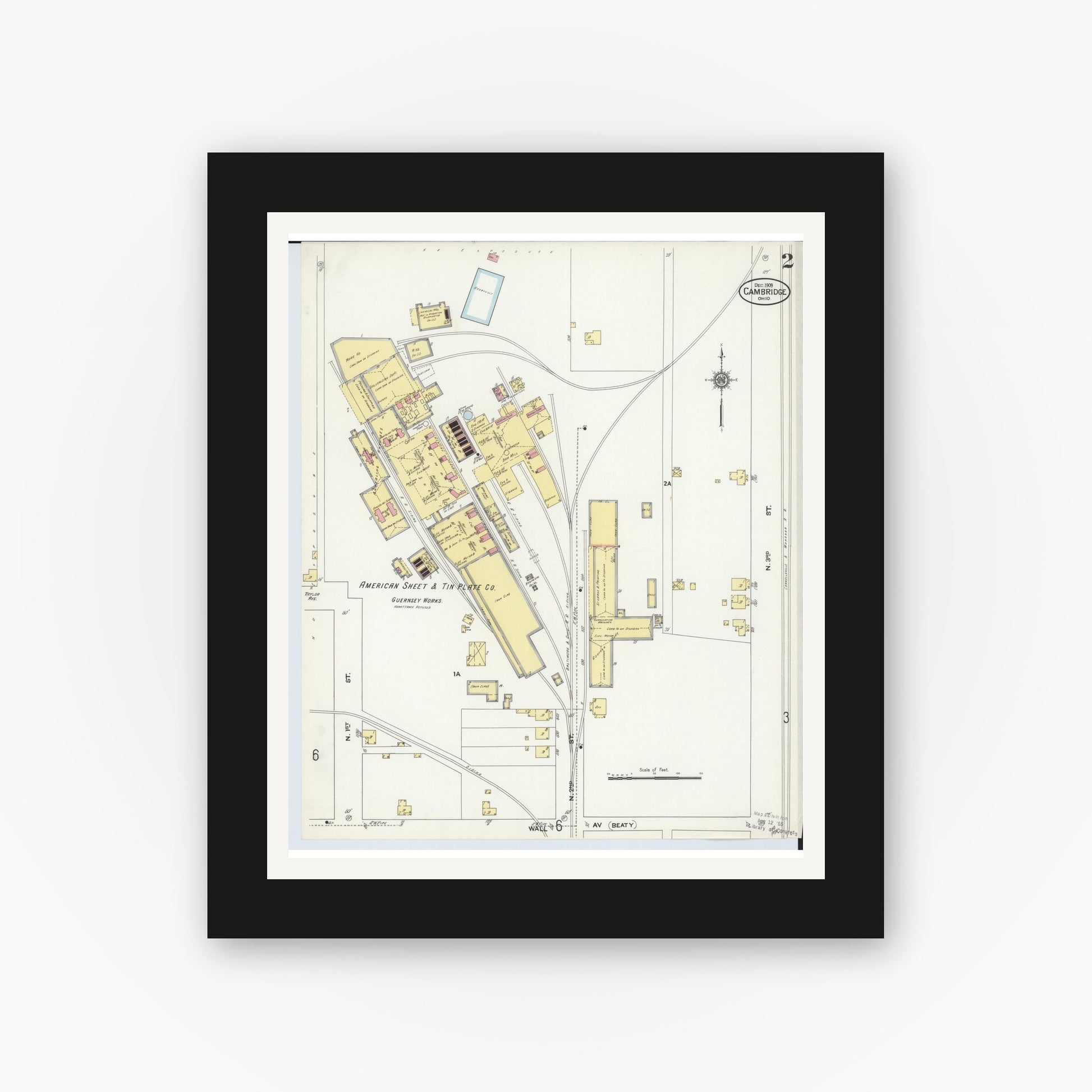 Old map wall art mockup — black gallery frame with white mat — Sanborn Fire Insurance Map from Cambridge, Guernsey County, Ohio (1909), Sheet #0002