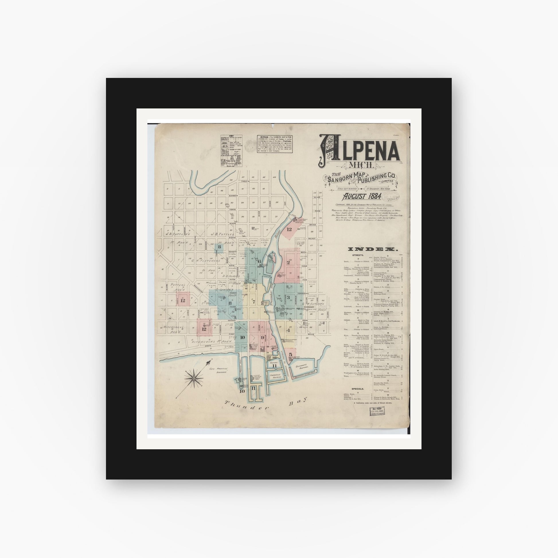 Old map wall art mockup — black gallery frame with white mat — Sanborn Fire Insurance Map from Alpena, Alpena County, Michigan (1884), Sheet #0001