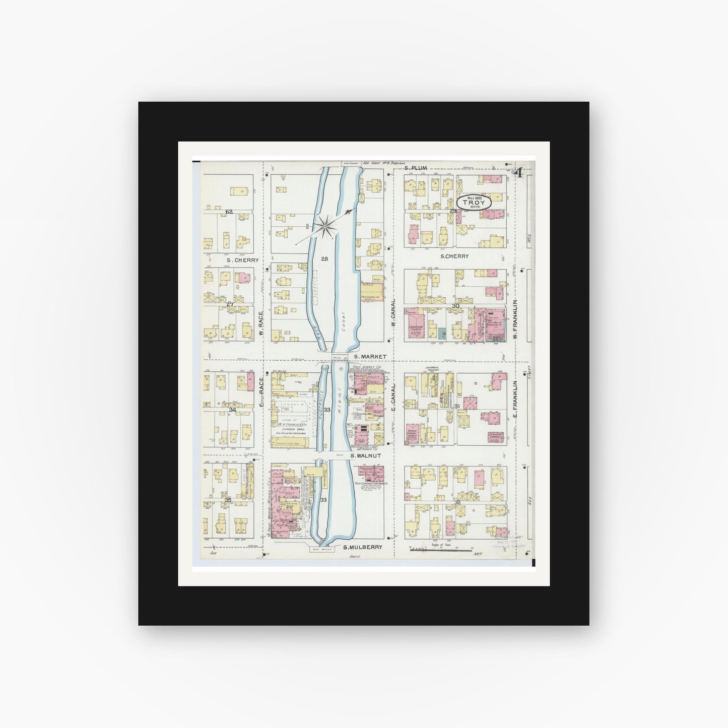 Old map wall art mockup — black gallery frame with white mat — Sanborn Fire Insurance Map from Troy, Miami County, Ohio (1892), Sheet #0004