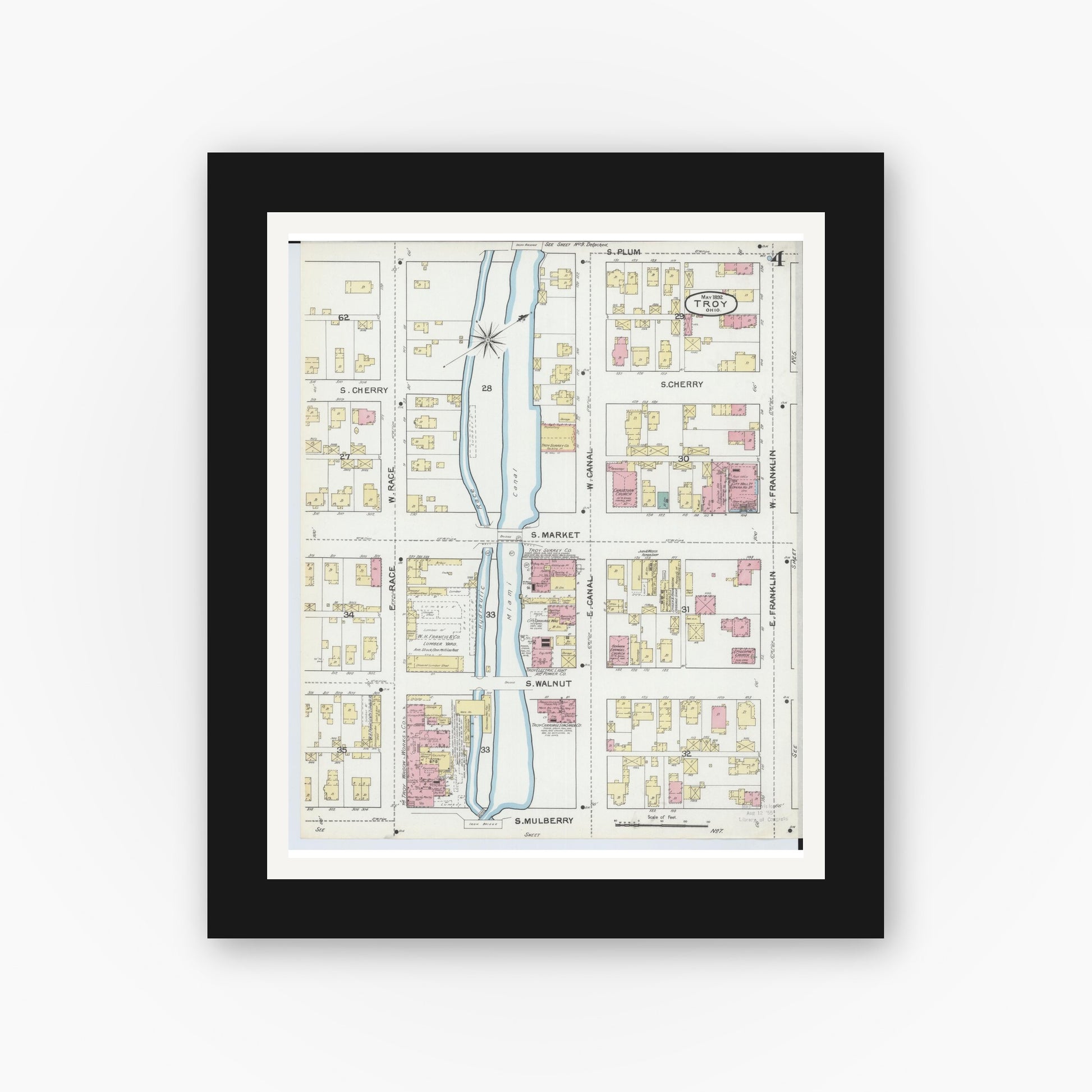Old map wall art mockup — black gallery frame with white mat — Sanborn Fire Insurance Map from Troy, Miami County, Ohio (1892), Sheet #0004