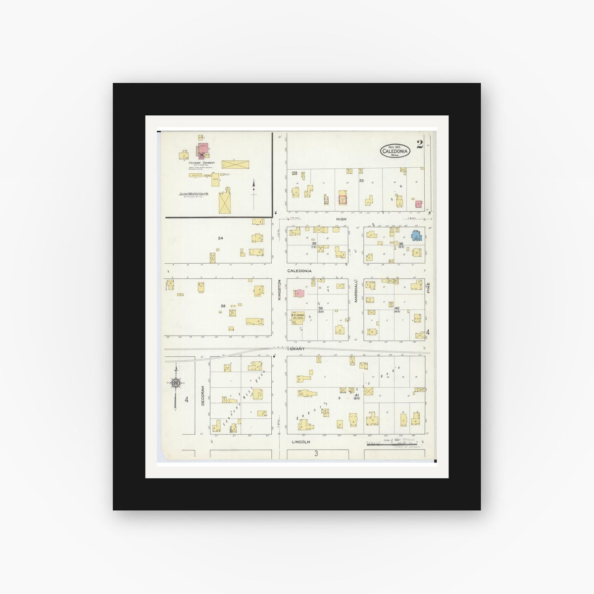 Old map wall art mockup — black gallery frame with white mat — Sanborn Fire Insurance Map from Caledonia, Houston County, Minnesota (1915), Sheet #0002