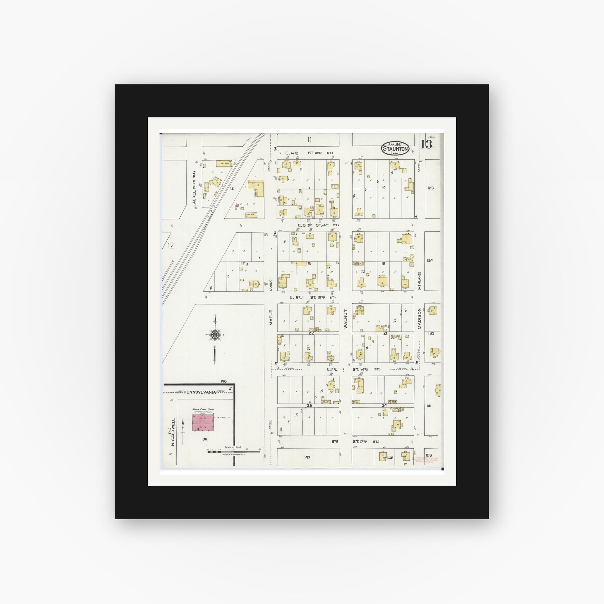 Old map wall art mockup — black gallery frame with white mat — Sanborn Fire Insurance Map from Staunton, Macoupin County, Illinois (1921), Sheet #0013